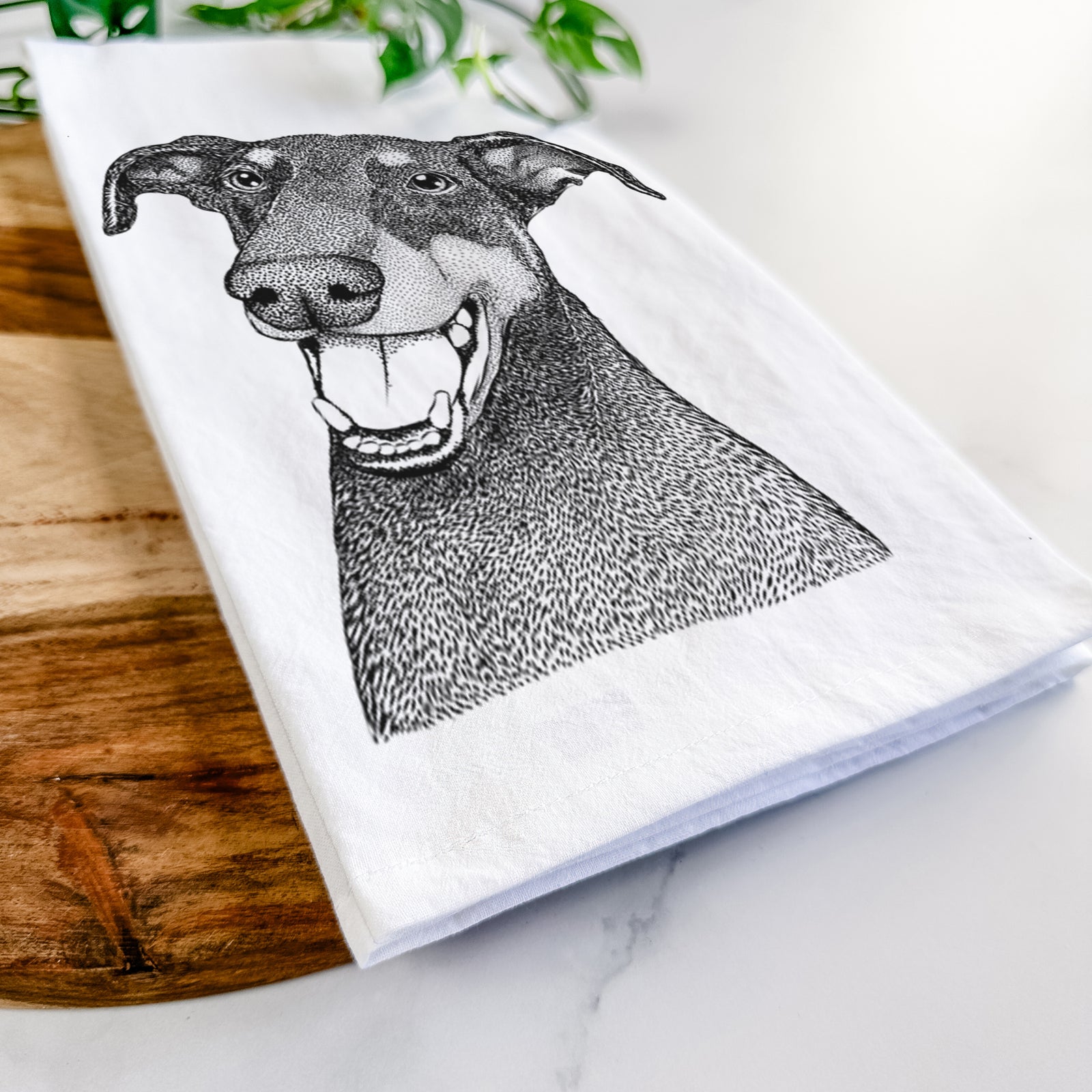 Hand-drawn sketch of Bunnie the Doberman Pinscher on a tea towel