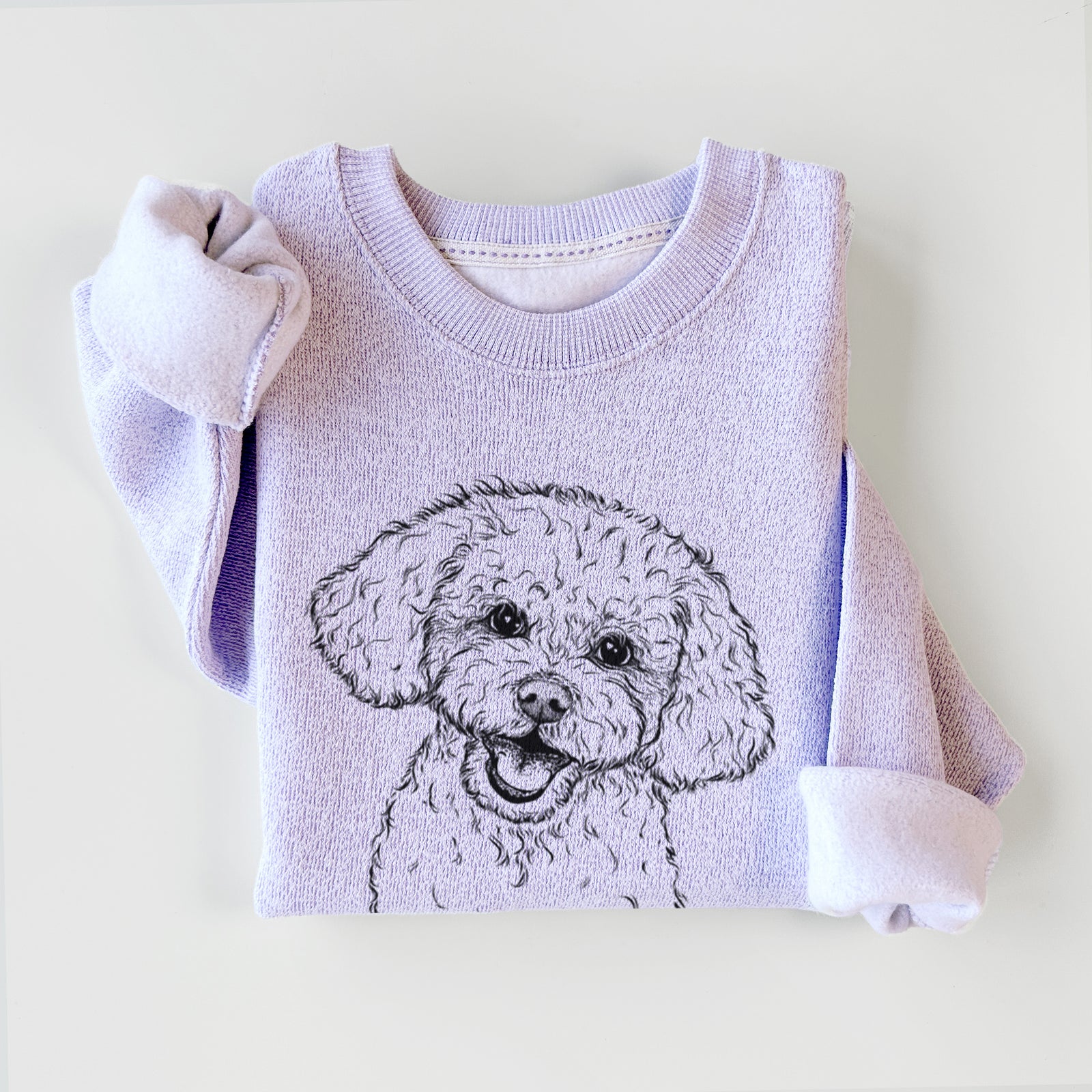 Hand-drawn sketch of Caesar the Bichon Frise on an Ice Purple knit sweatshirt