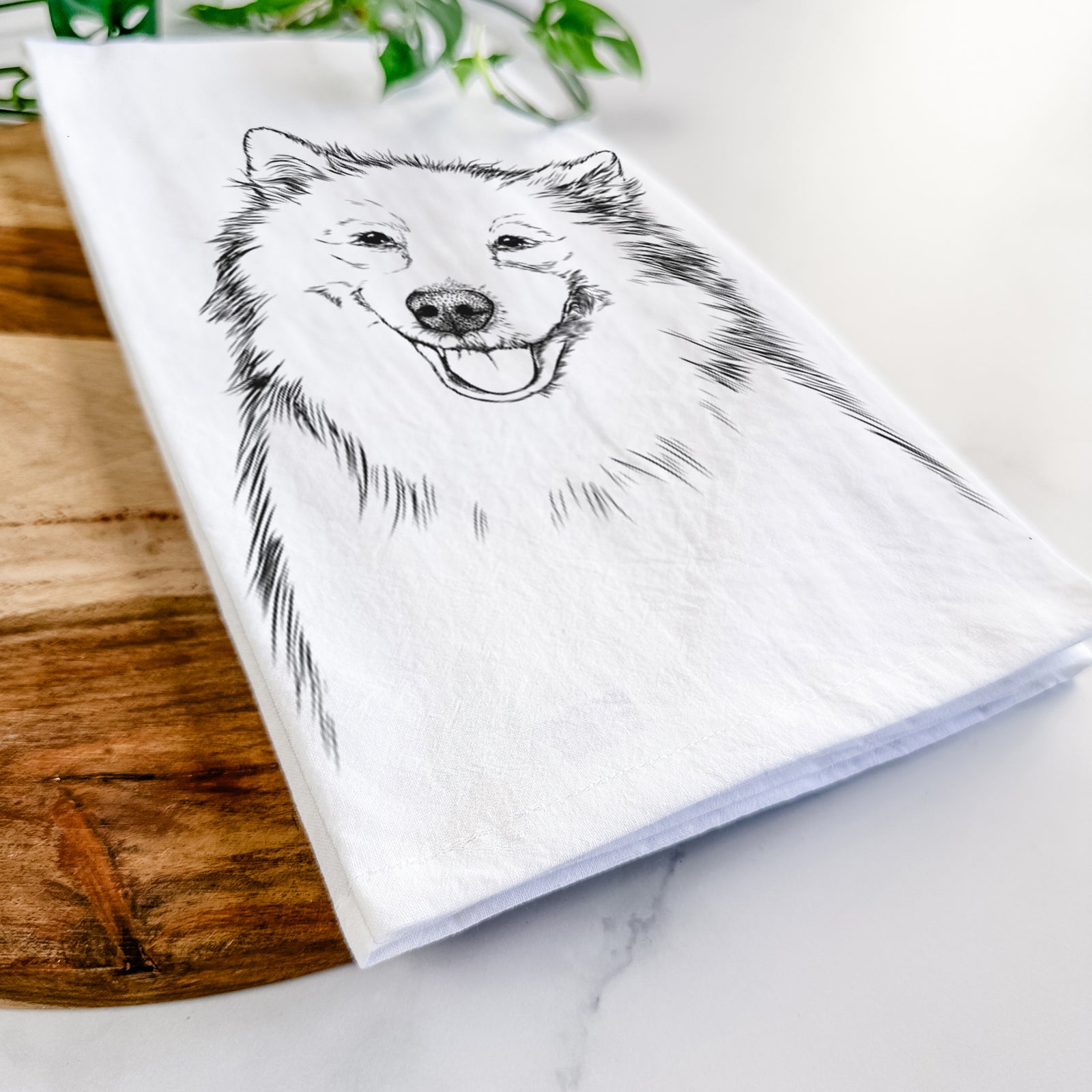 Hand-drawn sketch of Caico the Samoyed on a tea towel