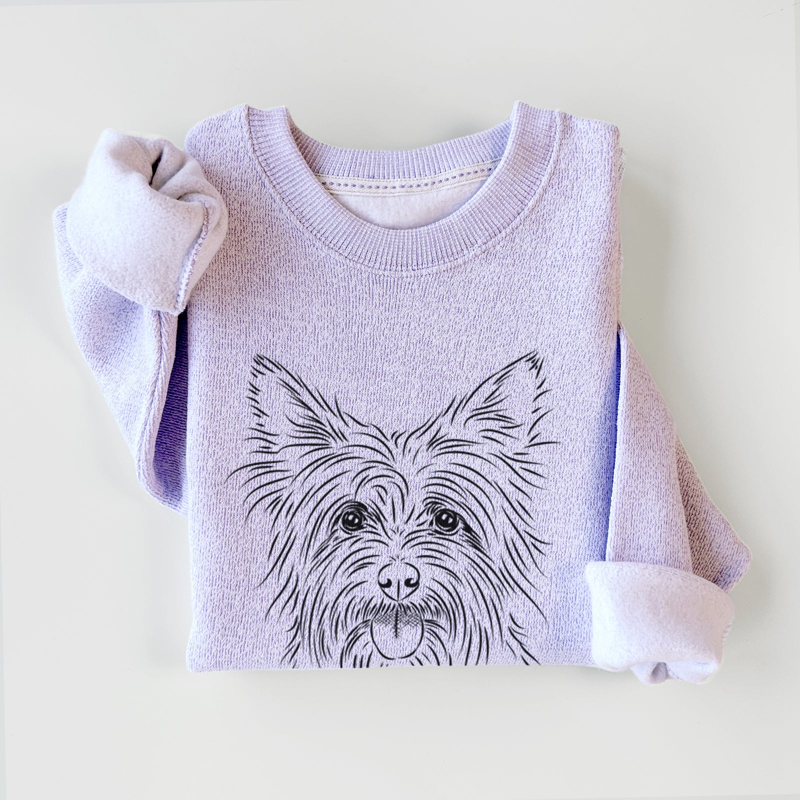 Hand-drawn sketch of Calum the Cairn Terrier on an Ice Purple knit sweatshirt