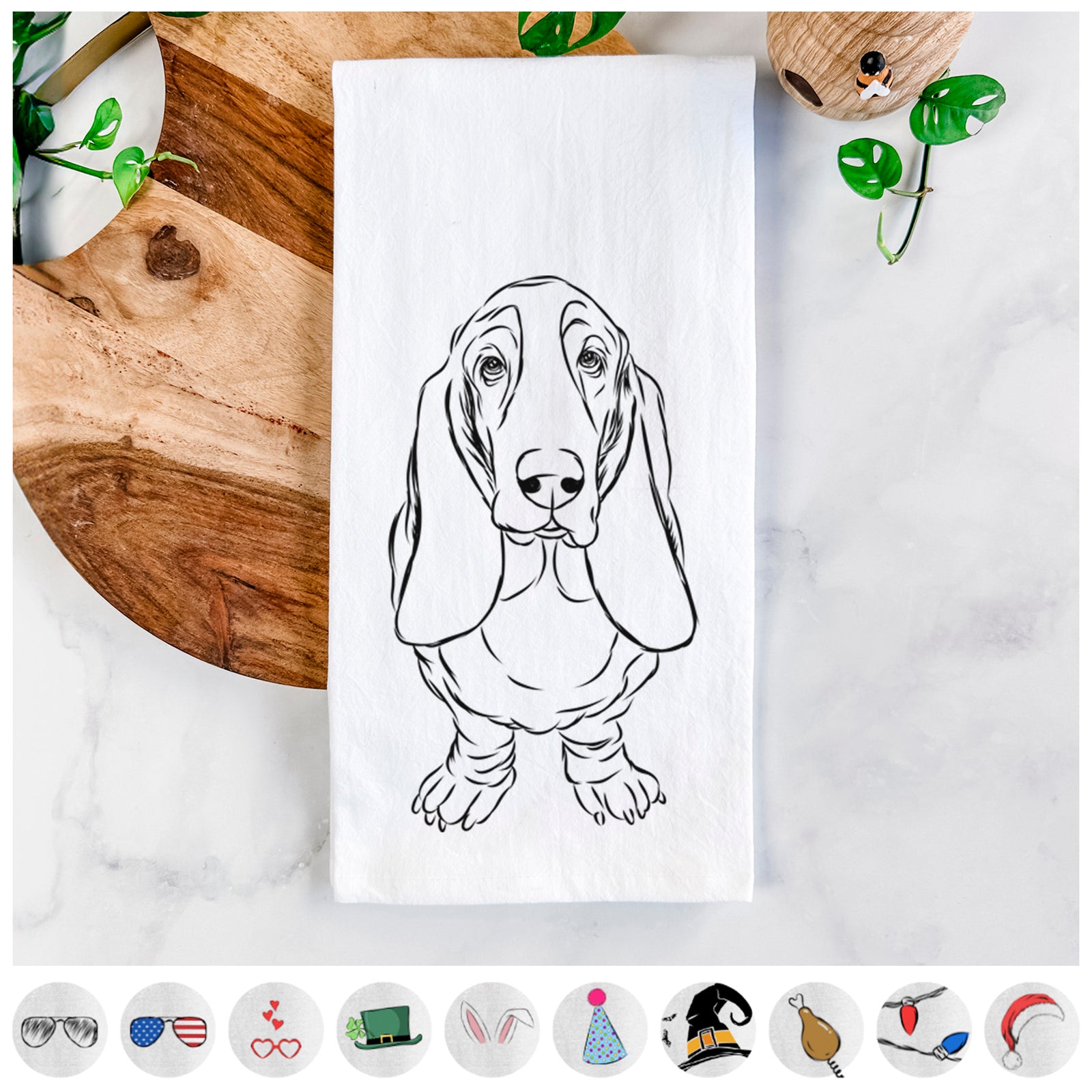 Hand-drawn sketch of Charlie the Basset Hound on a tea towel, shown with icons of the other available costume styles