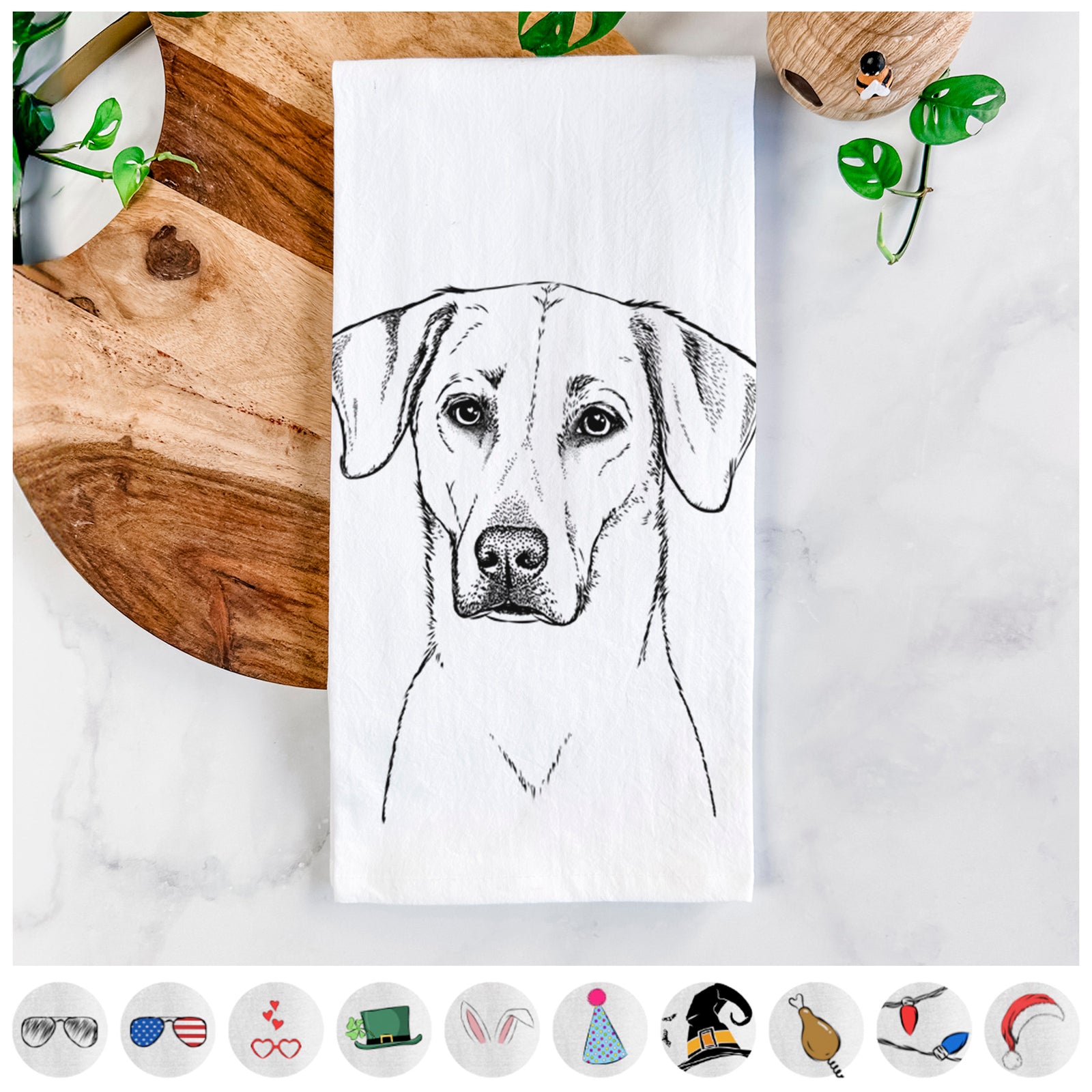 Hand-drawn sketch of Charlie Girl the Yellow Lab on a tea towel, shown with icons of the other available costume styles