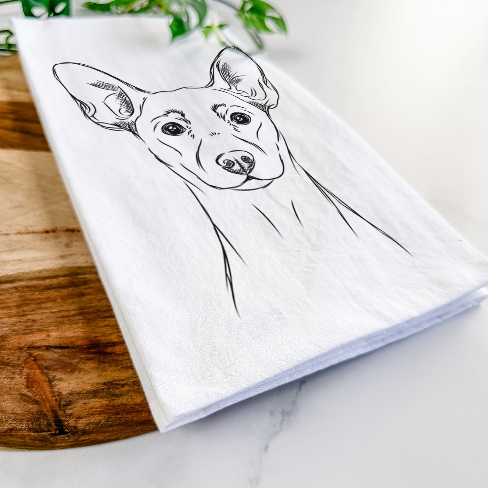 Hand-drawn sketch of Chillie the Mini Pinscher on a tea towel