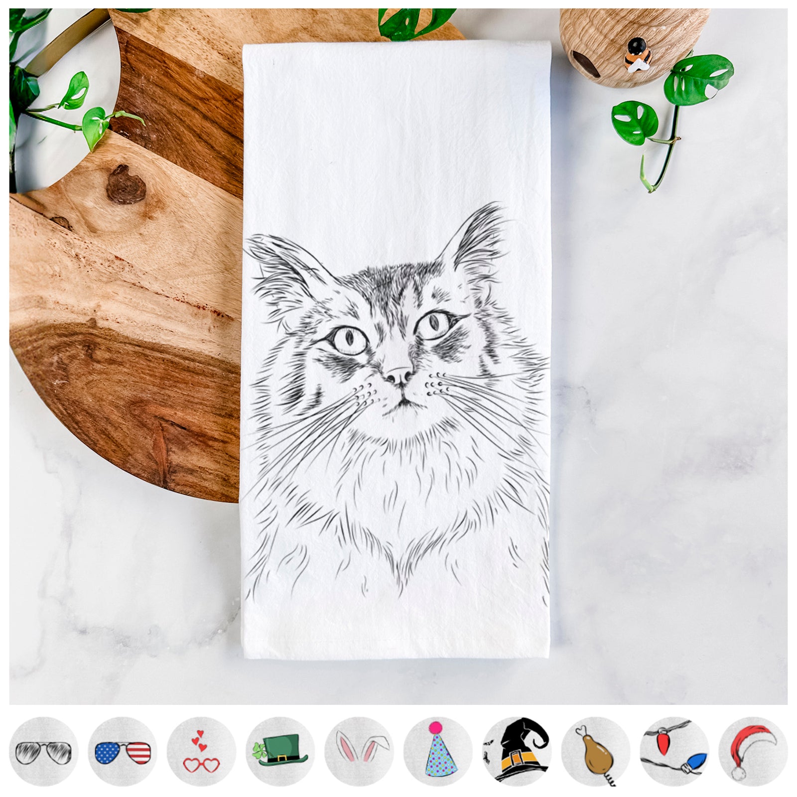 Hand-drawn sketch of Chloe the Tabby Cat on a tea towel, shown with icons of the other available costume styles
