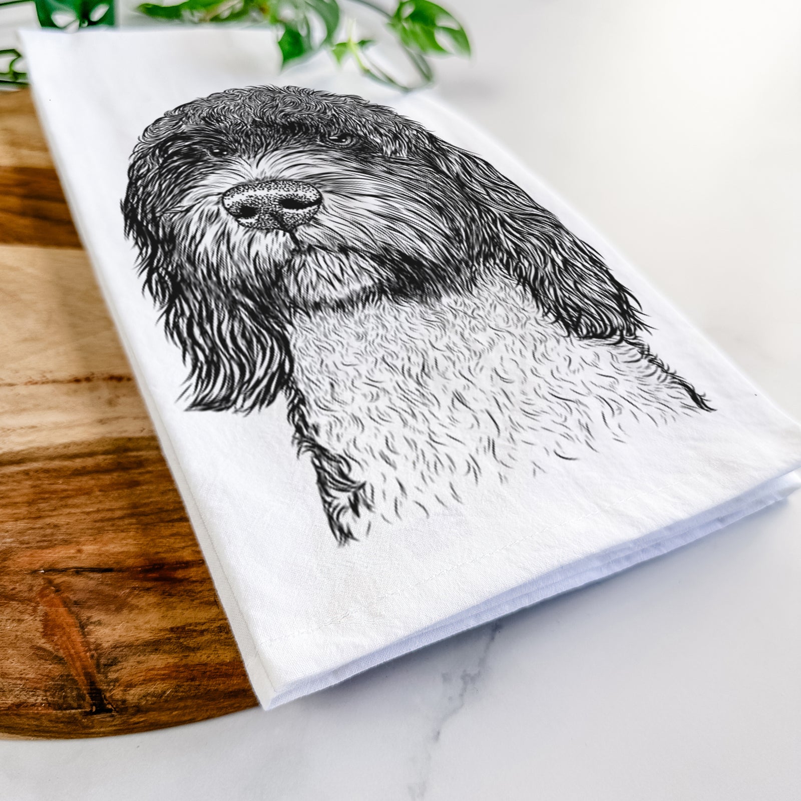 Hand-drawn sketch of Chris the Portuguese Water Dog on a tea towel