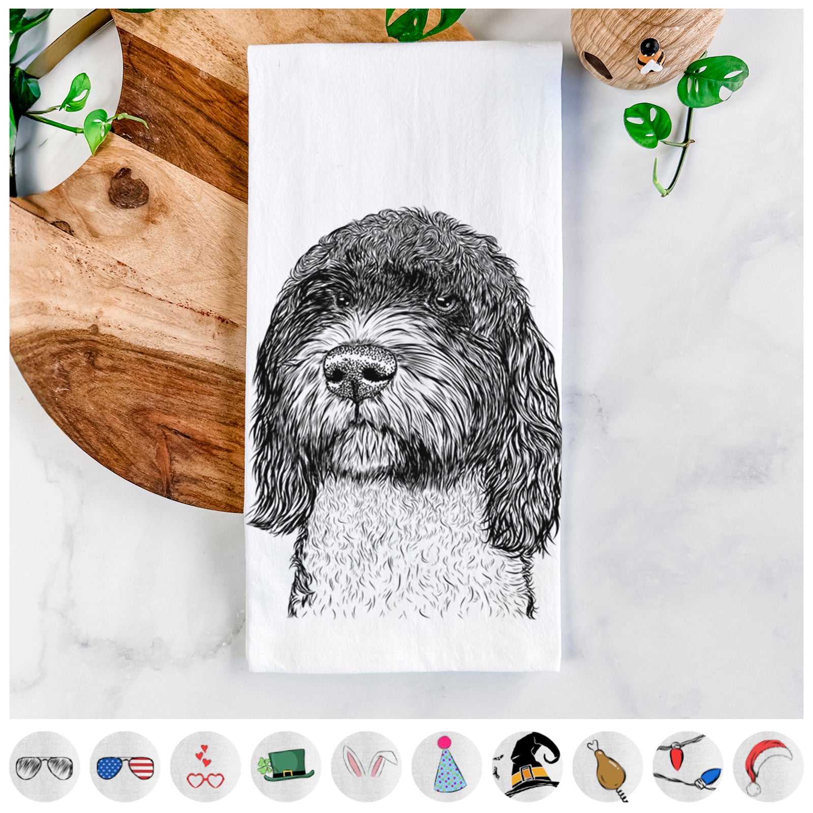 Hand-drawn sketch of Chris the Portuguese Water Dog on a tea towel, shown with icons of the other available costume styles