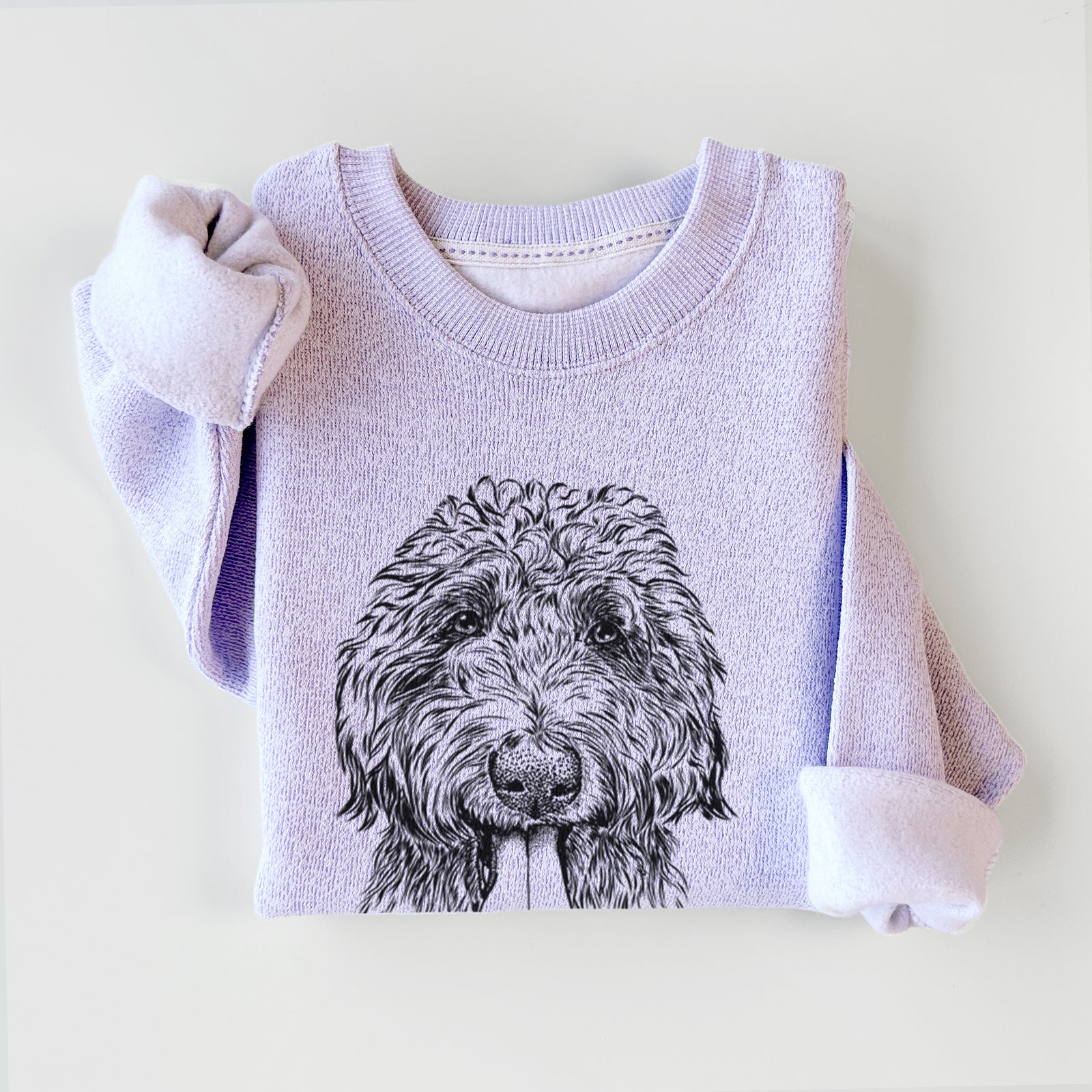 Hand-drawn sketch of CiCi Paulk the Aussiedoodle on an Ice Purple knit sweatshirt