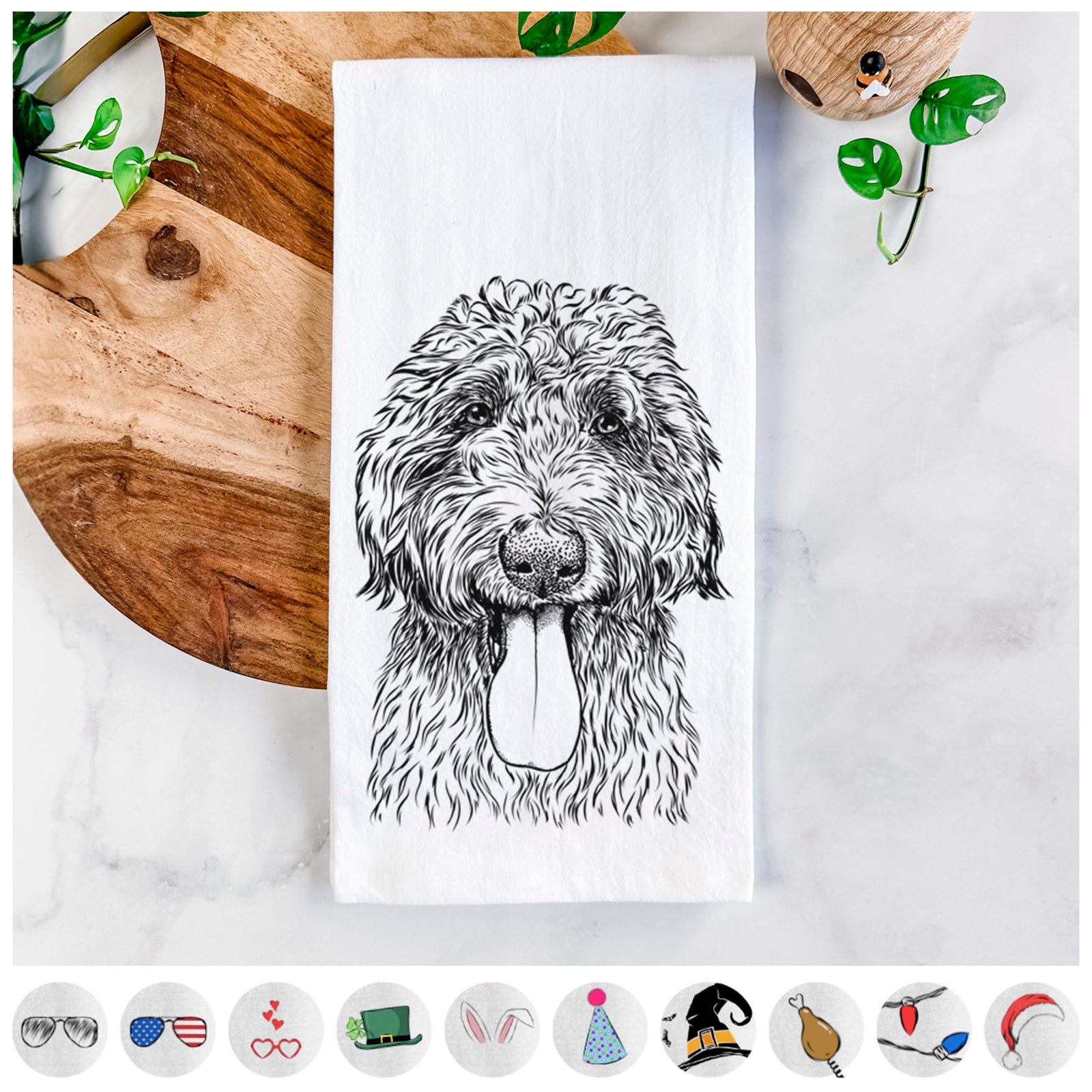 Hand-drawn sketch of CiCi Paulk the Aussiedoodle on a tea towel, shown with icons of the other available costume styles