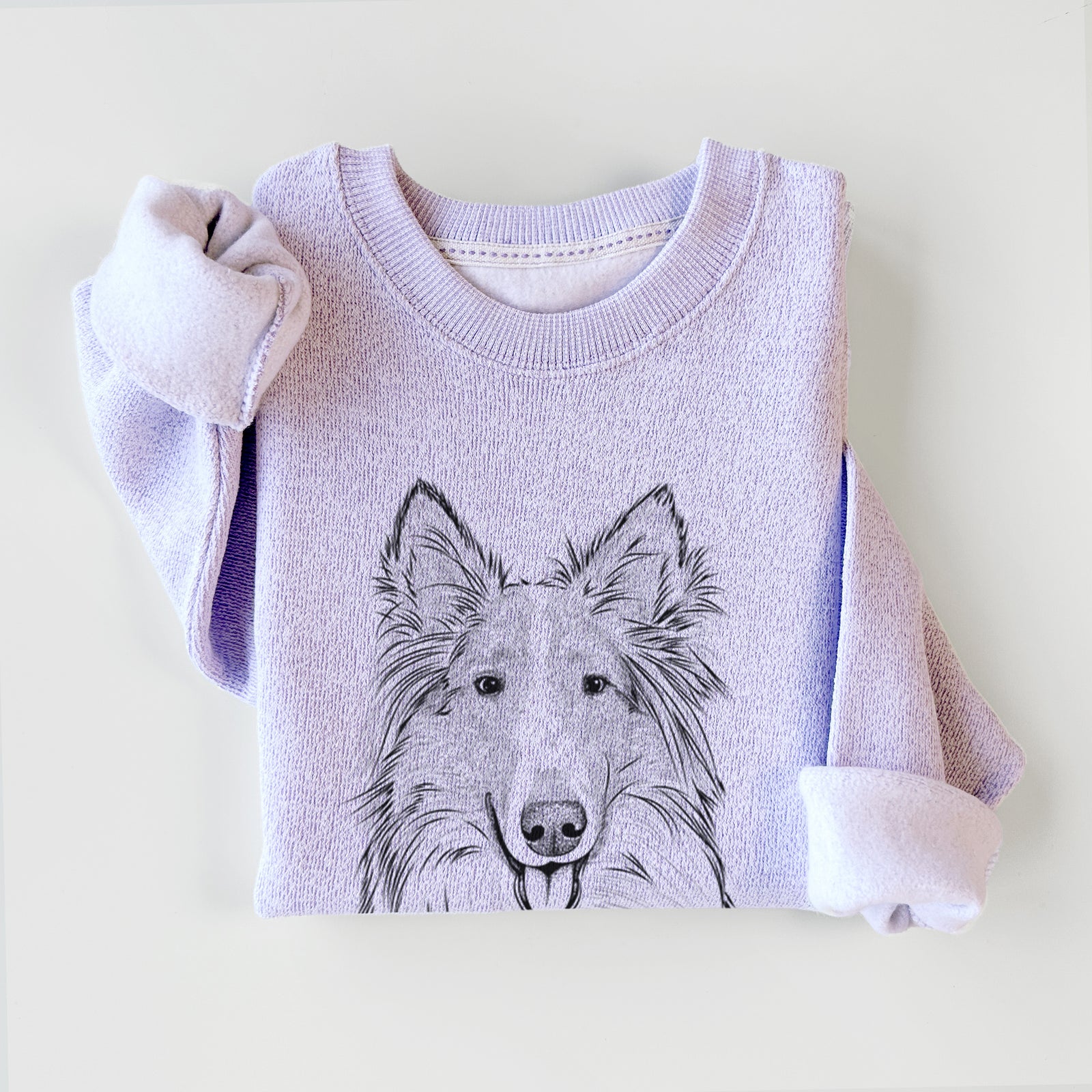 Hand-drawn sketch of Conrad the Rough Collie on an Ice Purple knit sweatshirt