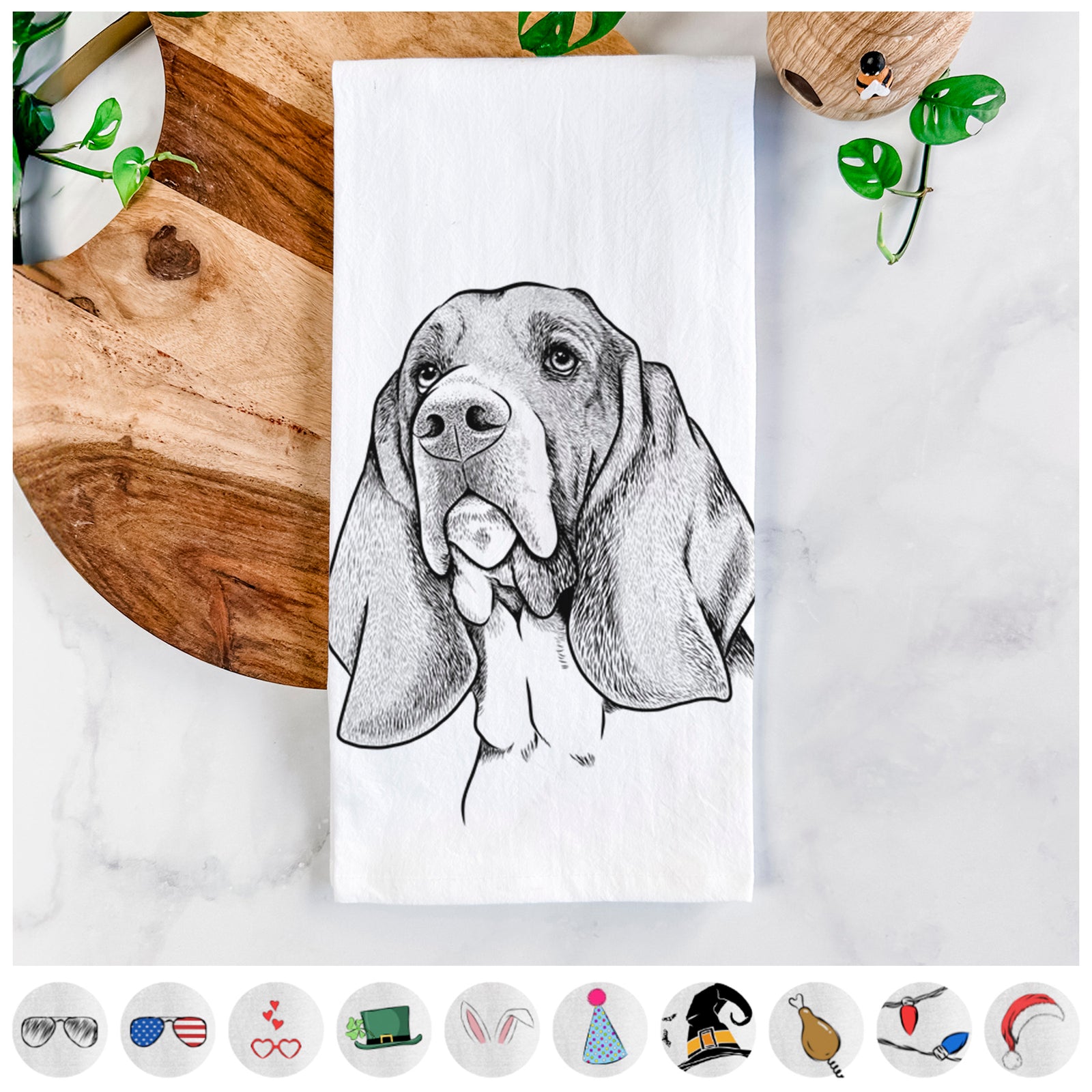 Hand-drawn sketch of Cooper the Basset Hound on a tea towel, shown with icons of the other available costume styles