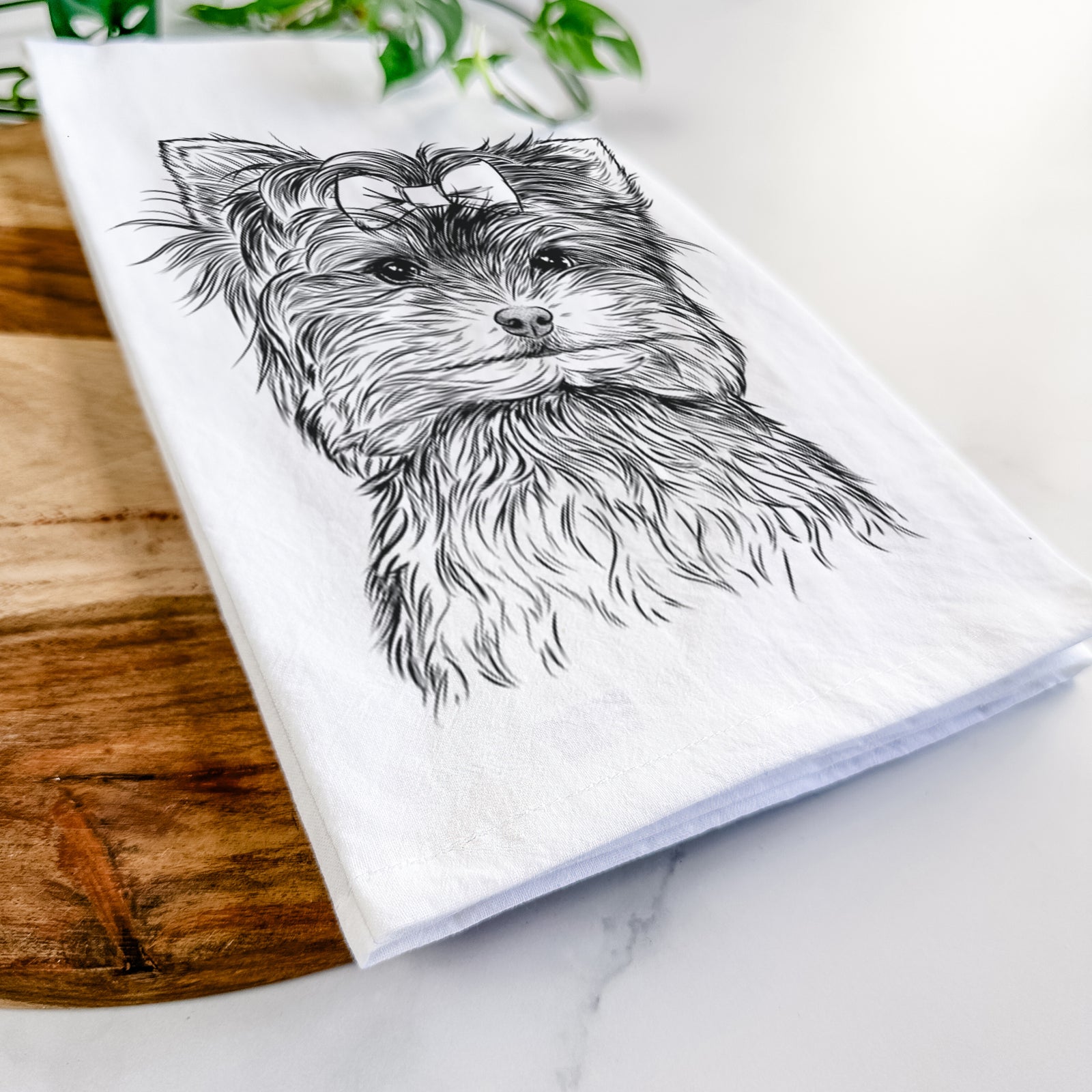 Hand-drawn sketch of Cricket the Biewer Terrier on a tea towel