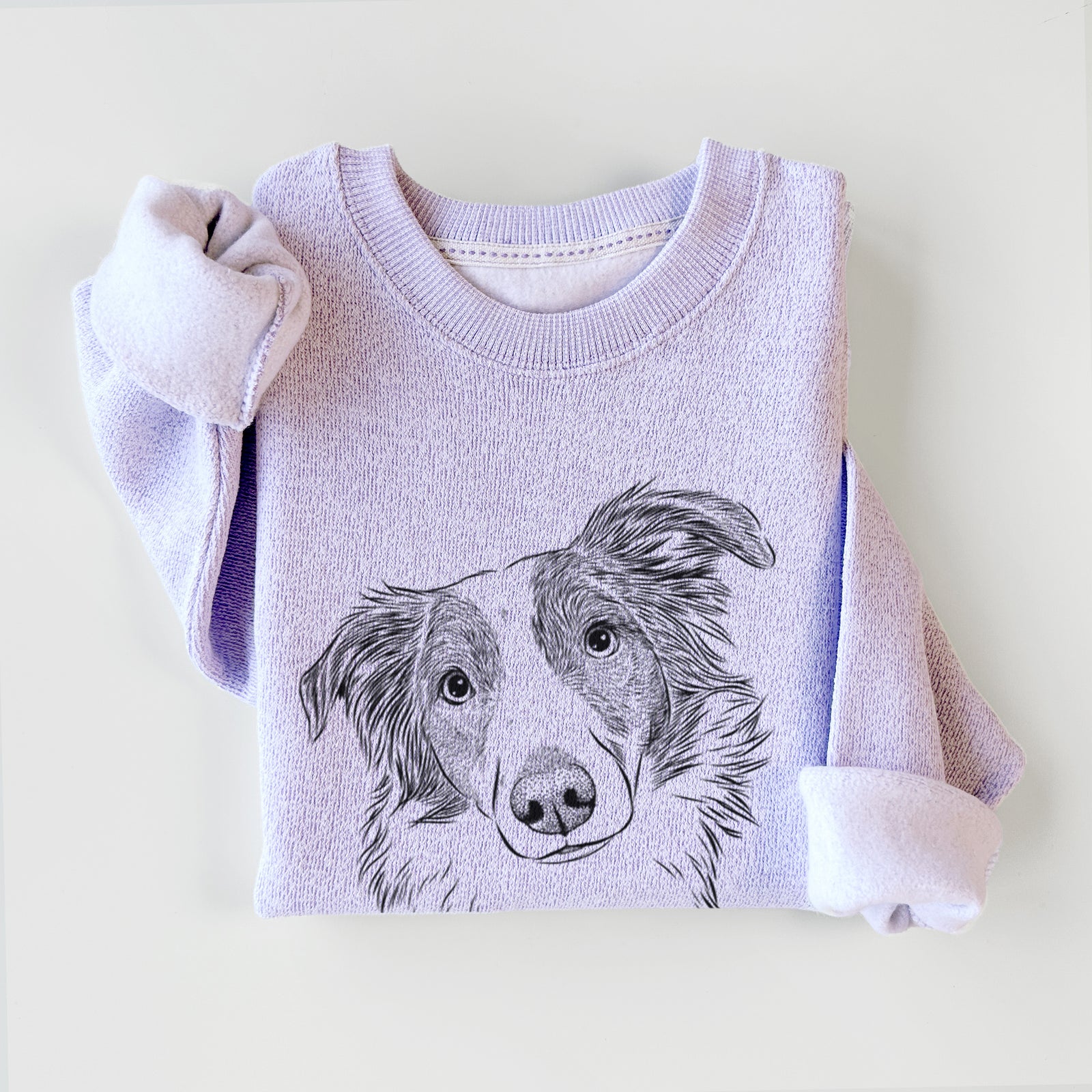 Hand-drawn sketch of Cyclone the Australian Shepherd on an Ice Purple knit sweatshirt