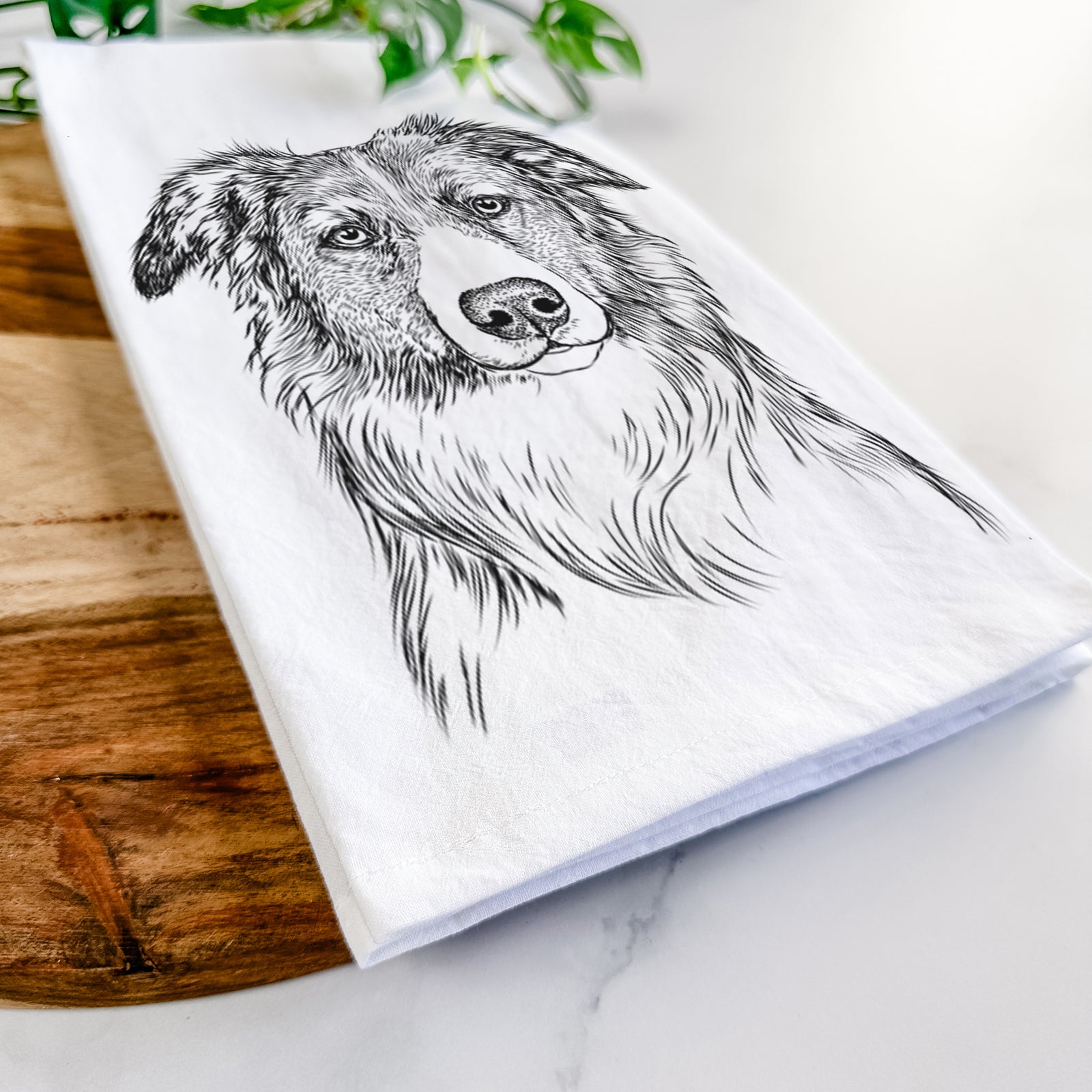 Hand-drawn sketch of Cynder the English Shepherd on a tea towel