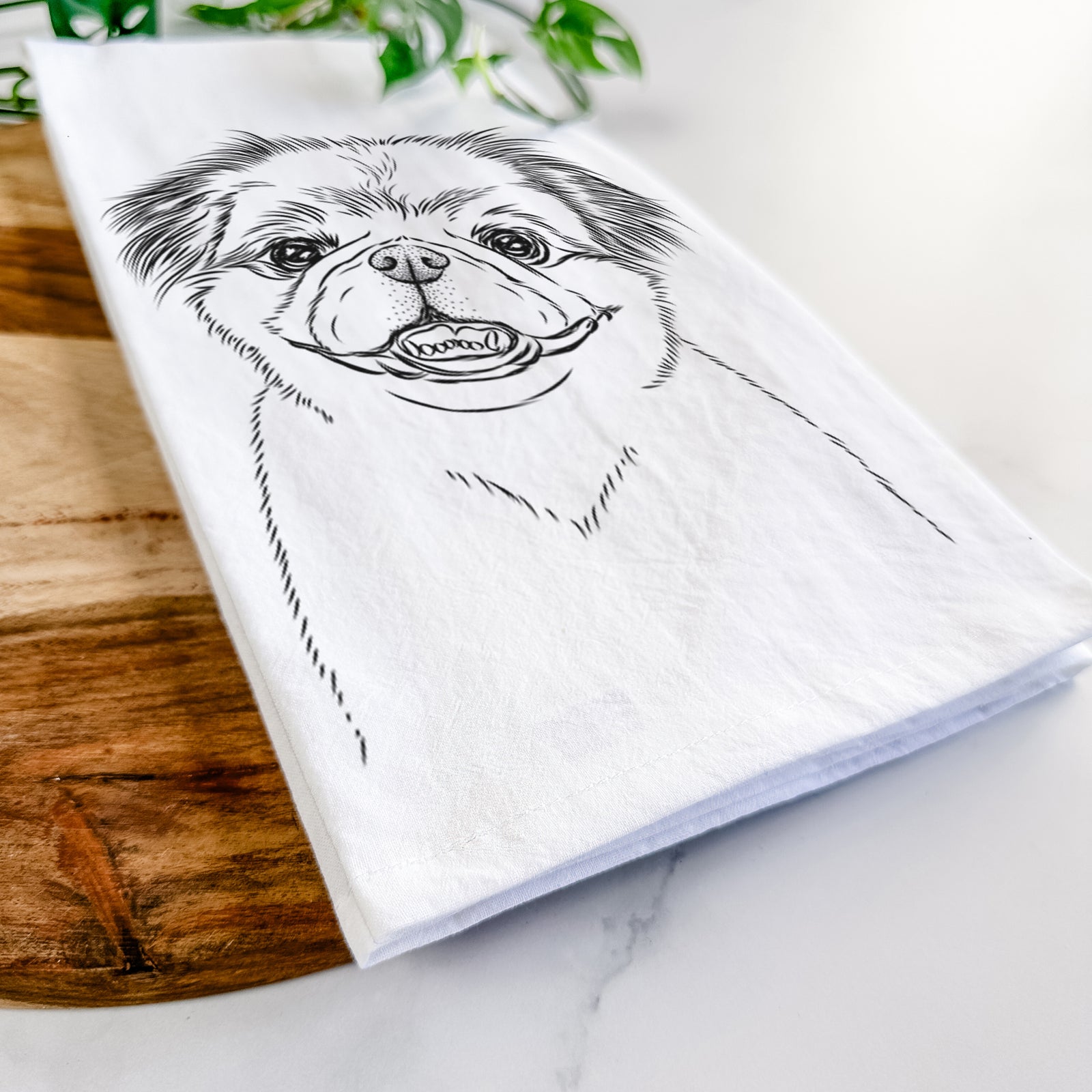Hand-drawn sketch of Danny the Pekingese on a tea towel