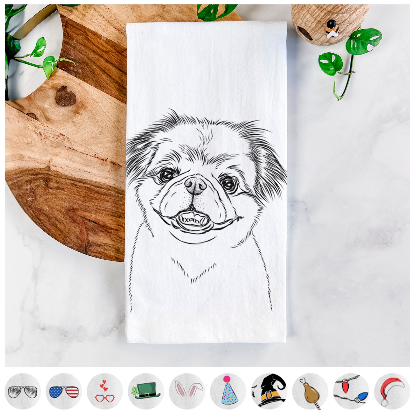 Hand-drawn sketch of Danny the Pekingese on a tea towel, shown with icons of the other available costume styles