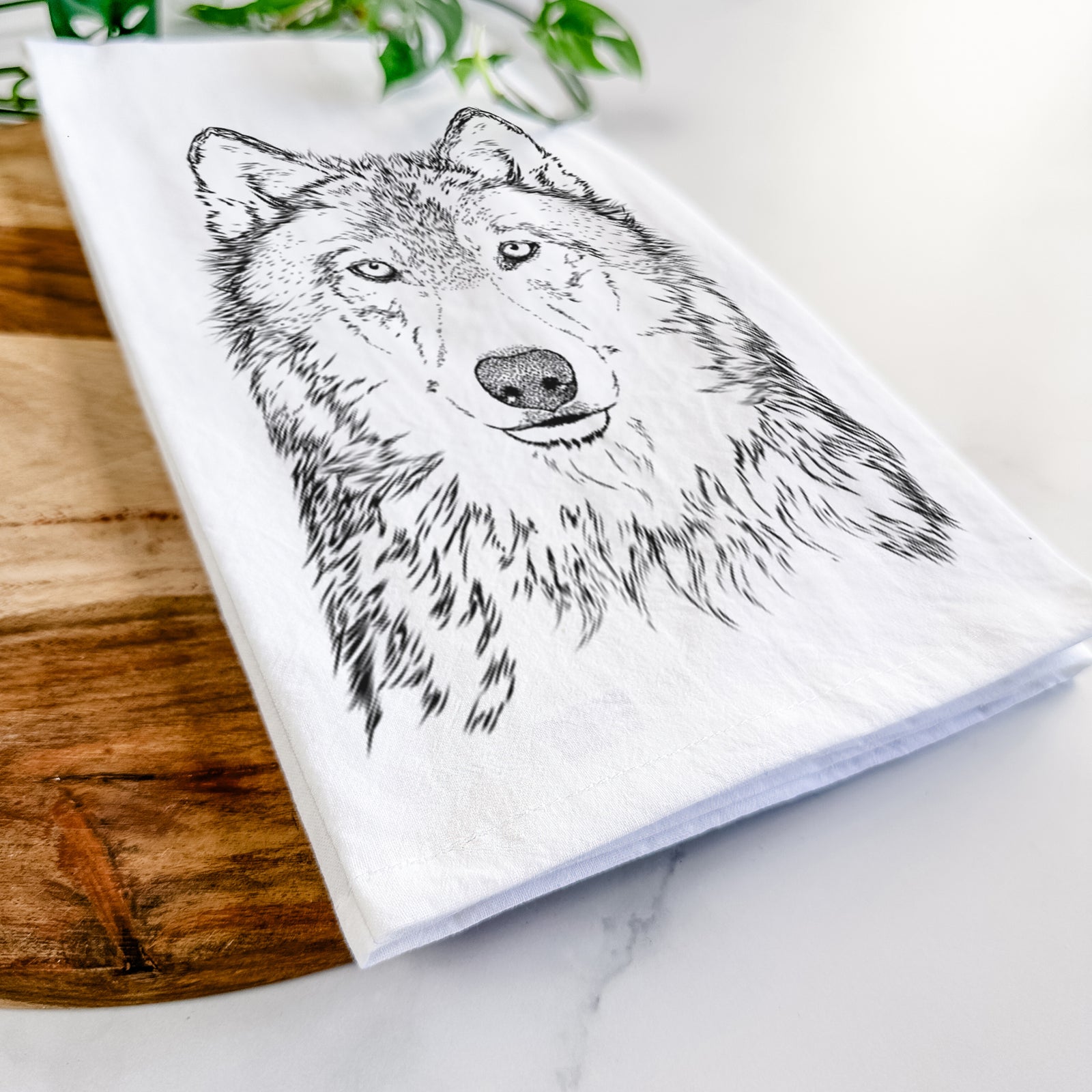 Hand-drawn sketch of Django the Grey Wolf on a tea towel