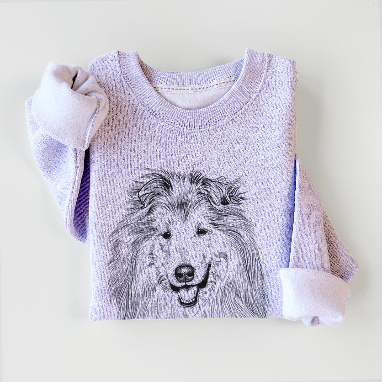 Hand-drawn sketch of Donnan the Rough Collie on an Ice Purple knit sweatshirt