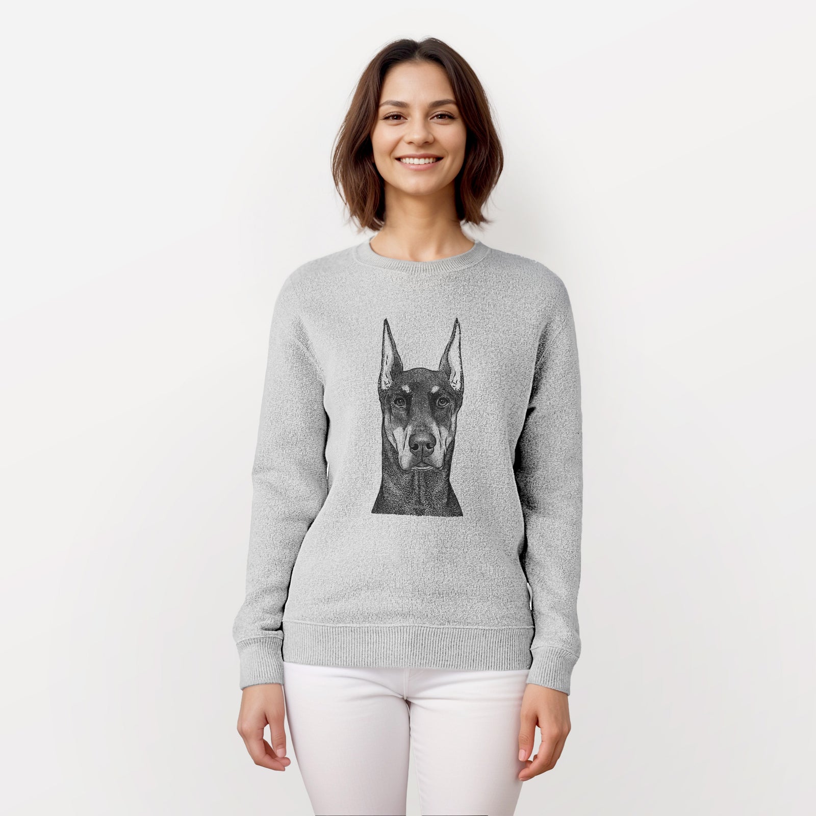 Hand-drawn sketch of Drake the Doberman Pinscher on a knit sweatshirt, worn by a woman