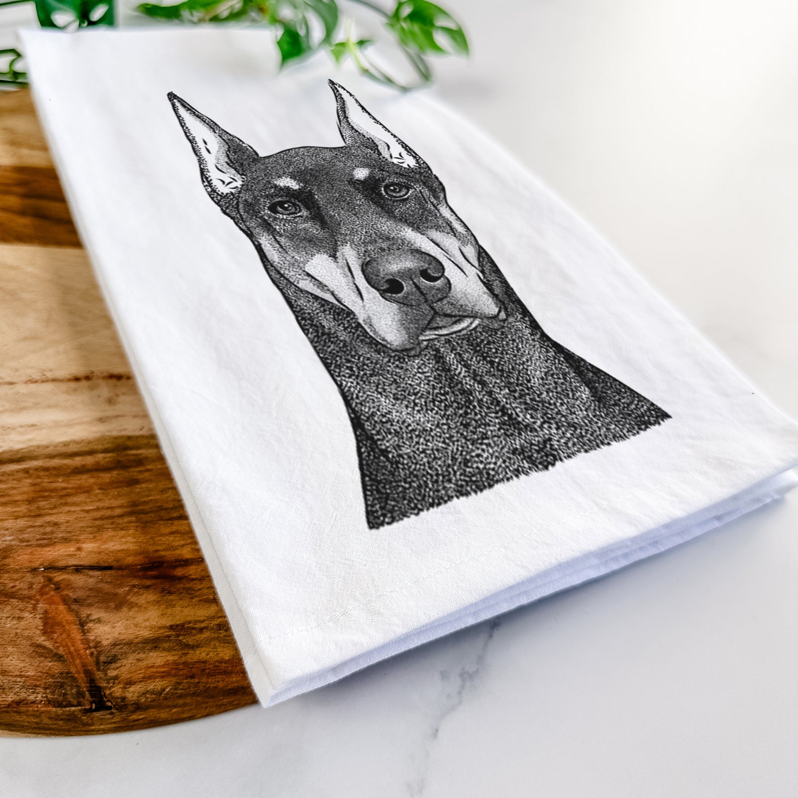 Hand-drawn sketch of Drake the Doberman Pinscher on a tea towel