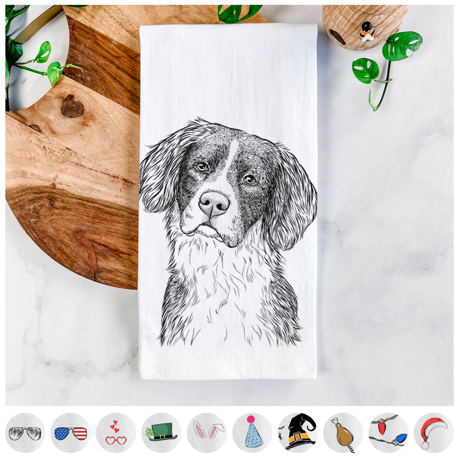 Hand-drawn sketch of Dulce the Drentsche Patrijshond on a tea towel, shown with icons of the other available costume styles