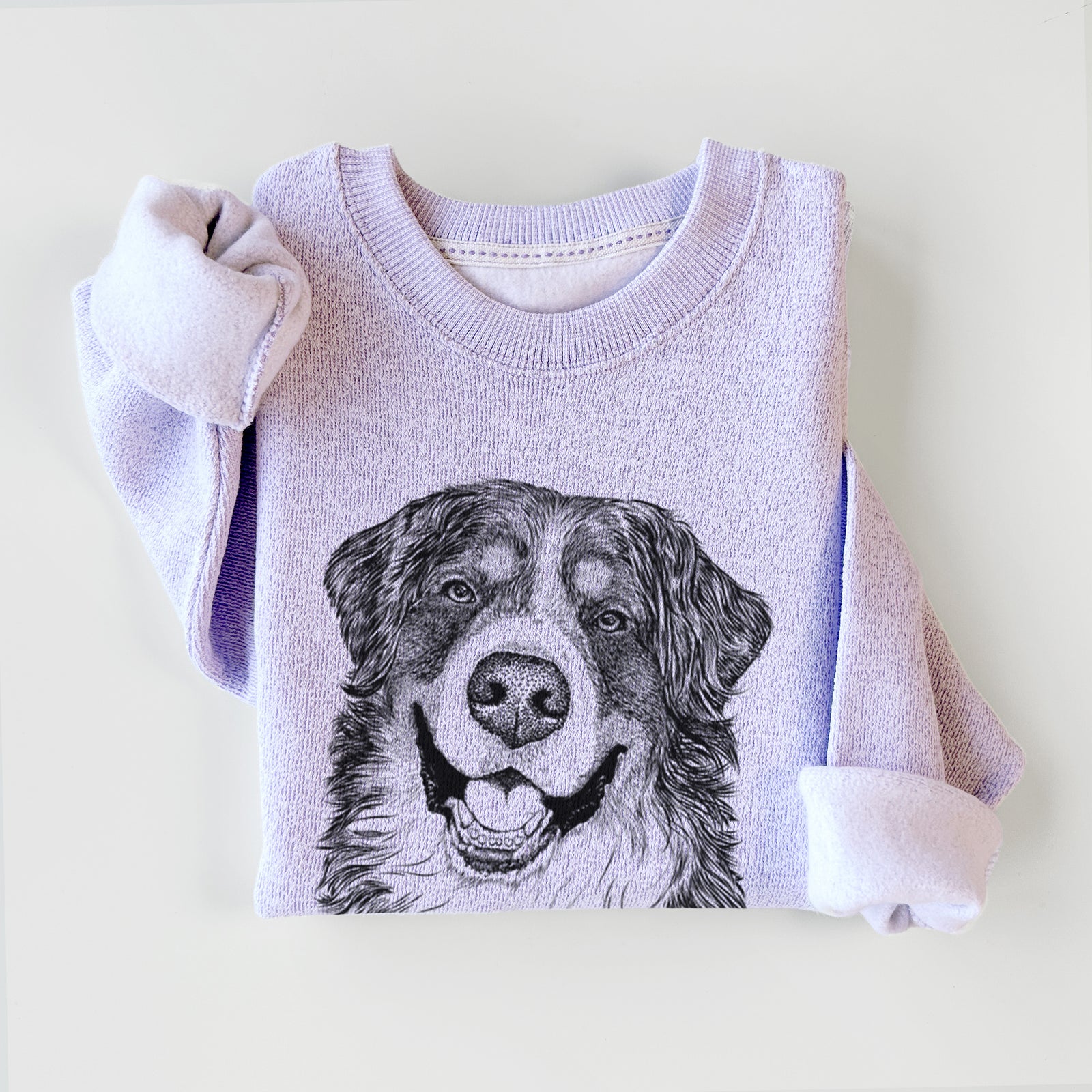 Hand-drawn sketch of Eiger the Bernese Mountain Dog on an Ice Purple knit sweatshirt