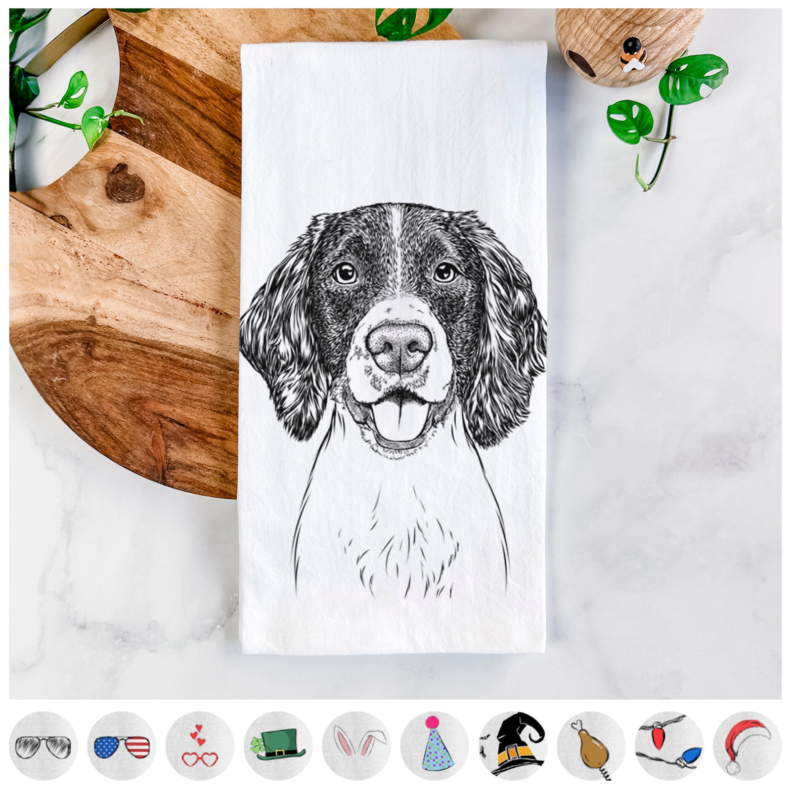 Hand-drawn sketch of Ever the English Springer Spaniel on a tea towel, shown with icons of the other available costume styles