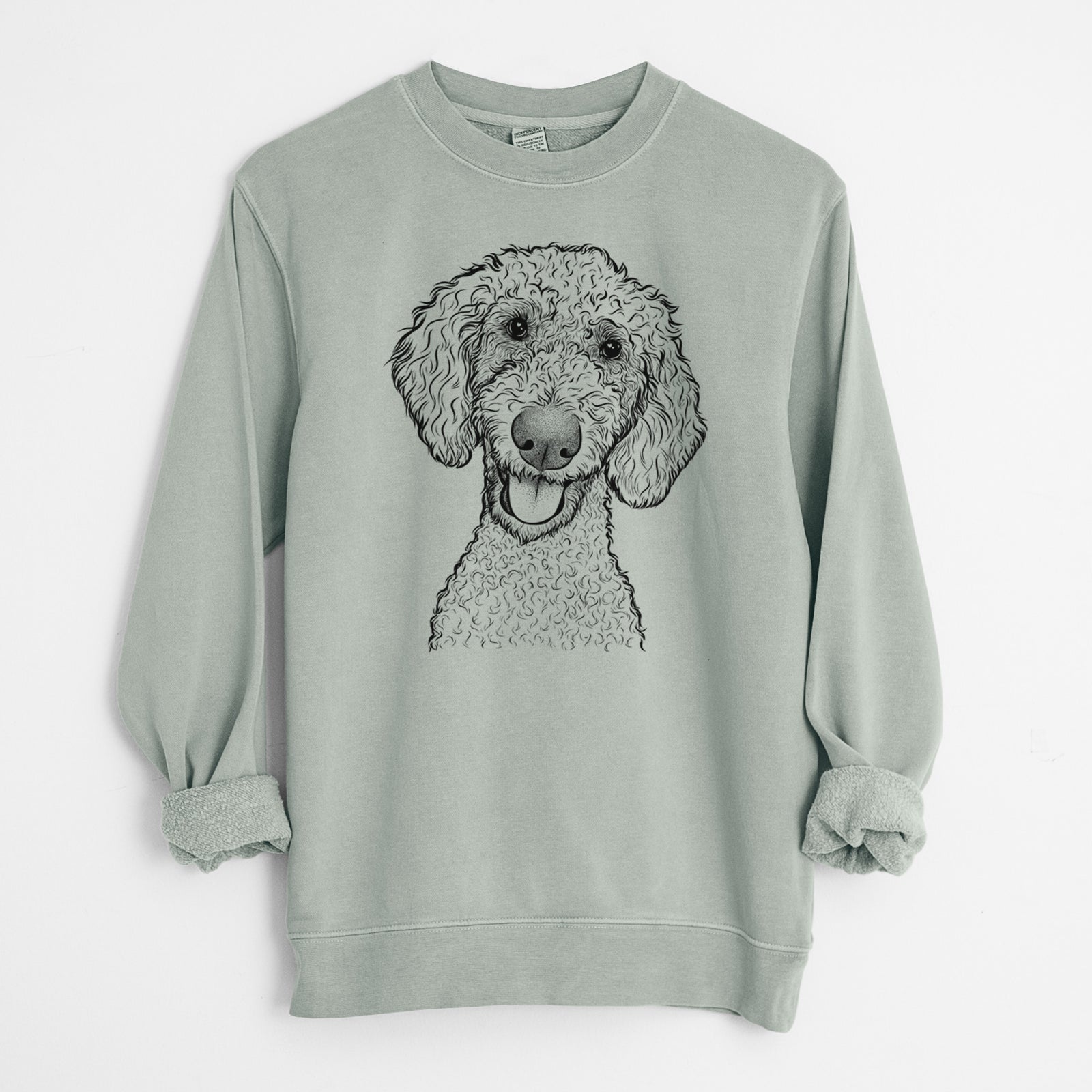 Hand-drawn sketch of Fenway the Goldendoodle on a Sage Unisex pigment dyed crew sweatshirt