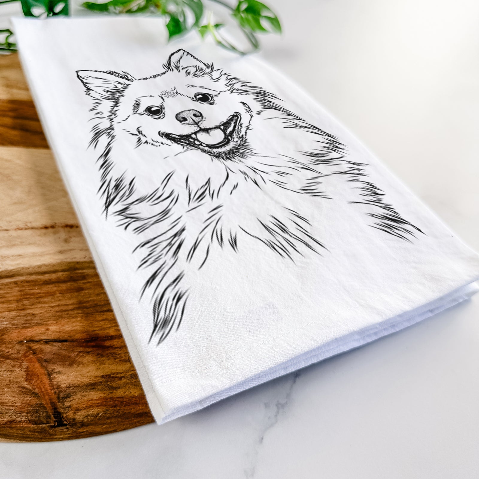 Hand-drawn sketch of Fibi the Spitz on a tea towel
