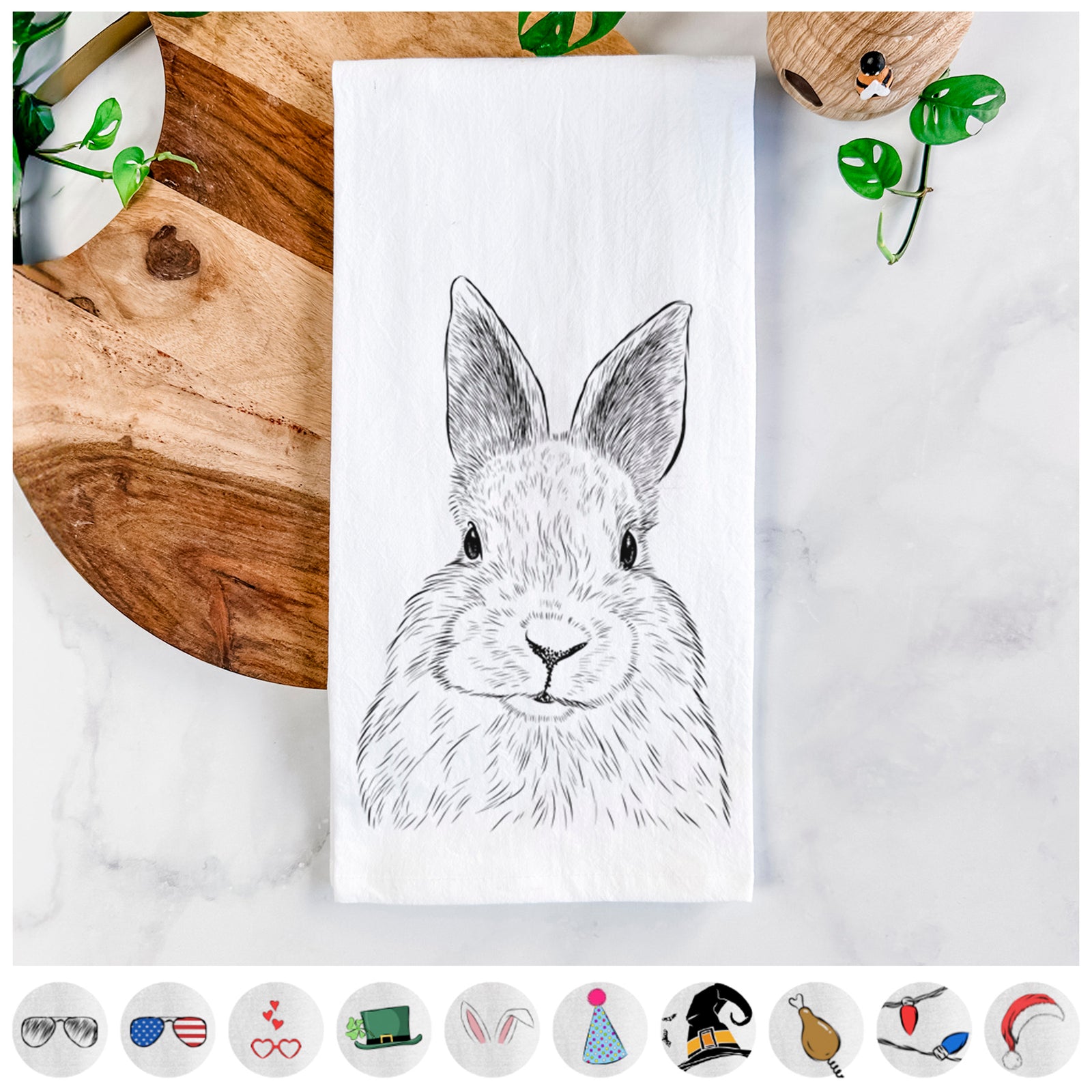 Hand-drawn sketch of Flower the Rex Rabbit on a tea towel, shown with icons of the other available costume styles