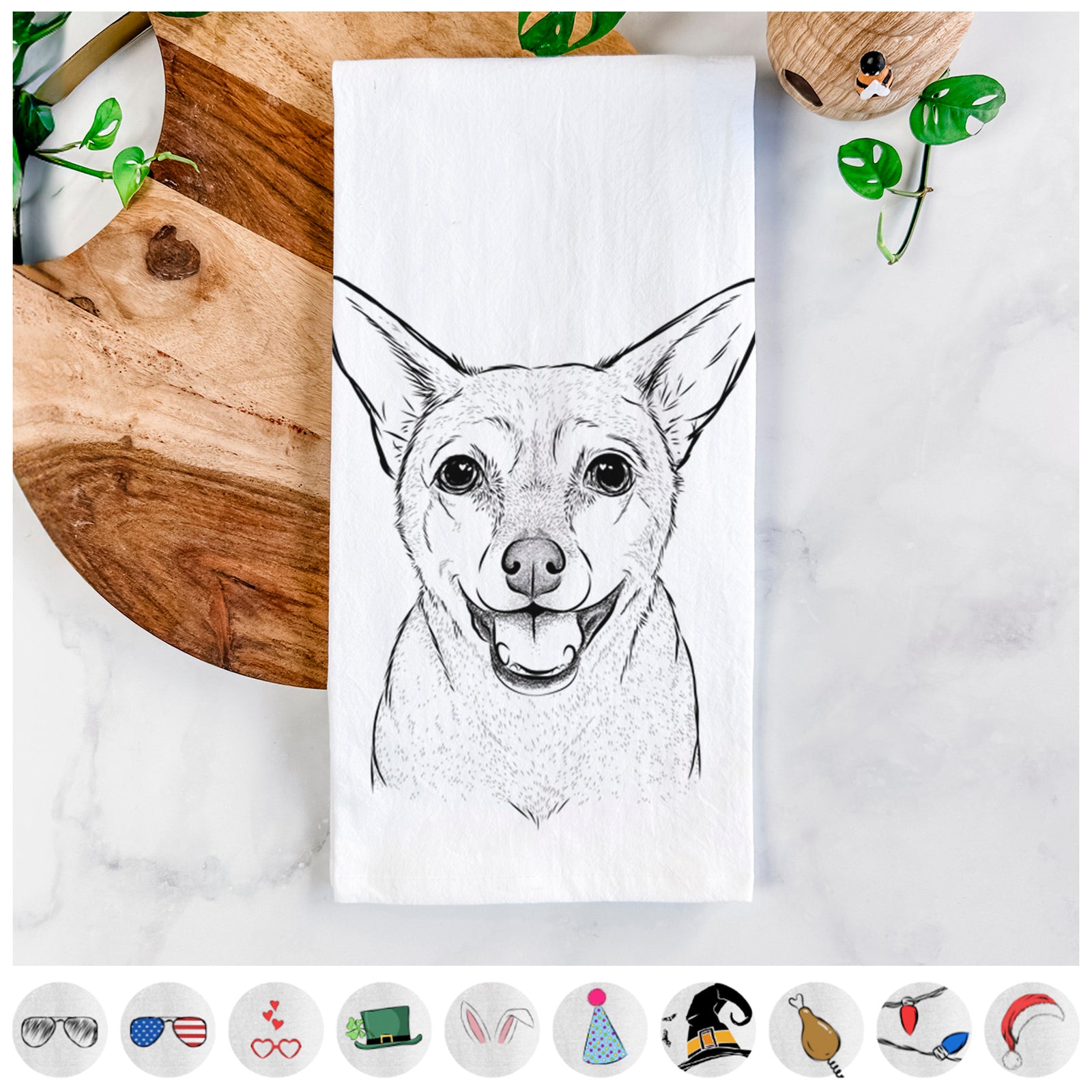 Hand-drawn sketch of Georgie the Chiweenie on a tea towel, shown with icons of the other available costume styles