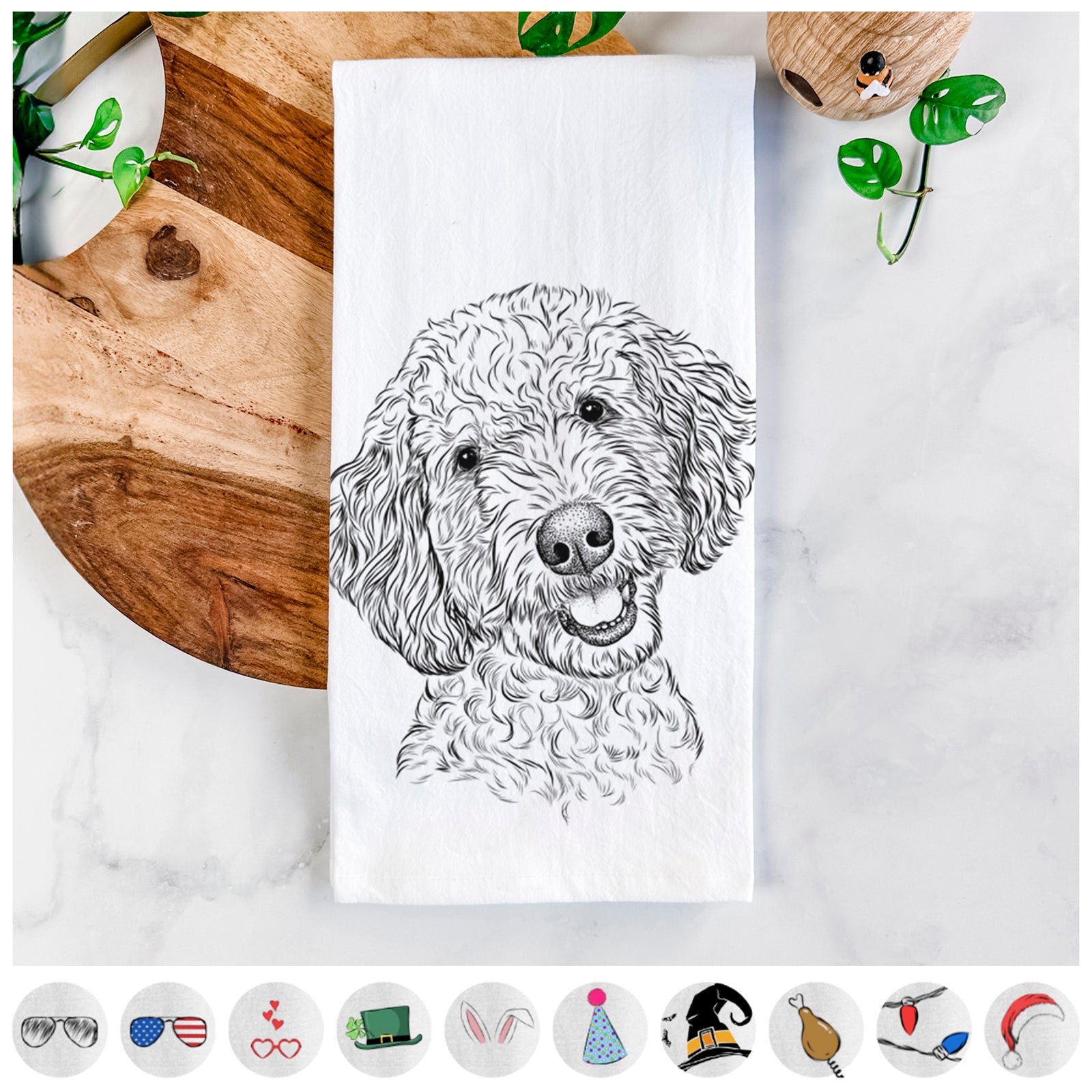 Hand-drawn sketch of Gizmo the Goldendoodle on a tea towel, shown with icons of the other available costume styles