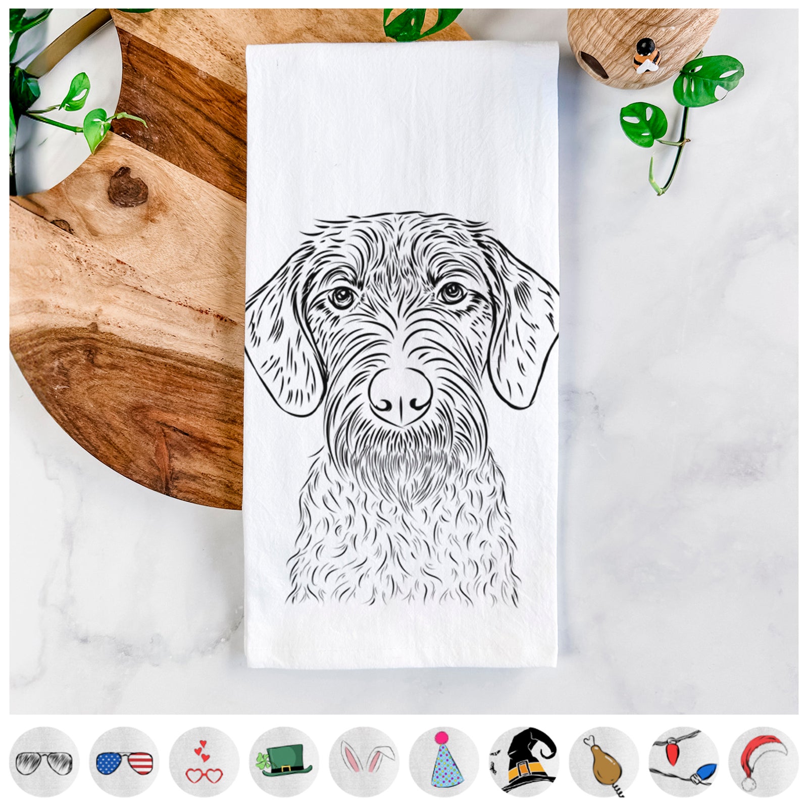 Hand-drawn sketch of Gus the German Wirehaired Pointer on a tea towel, shown with icons of the other available costume styles