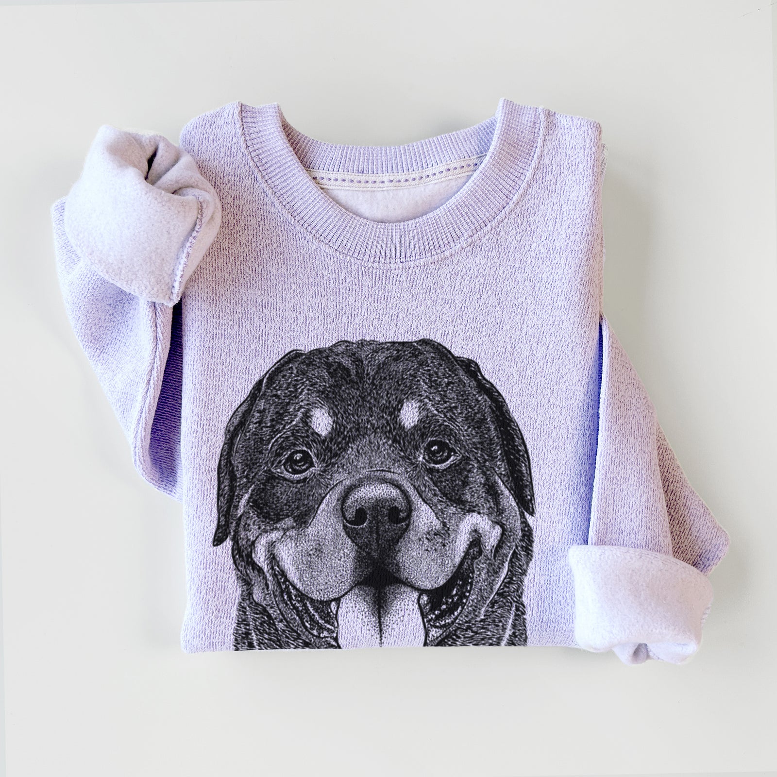 Hand-drawn sketch of Hagan the Rottweiler on an Ice Purple knit sweatshirt