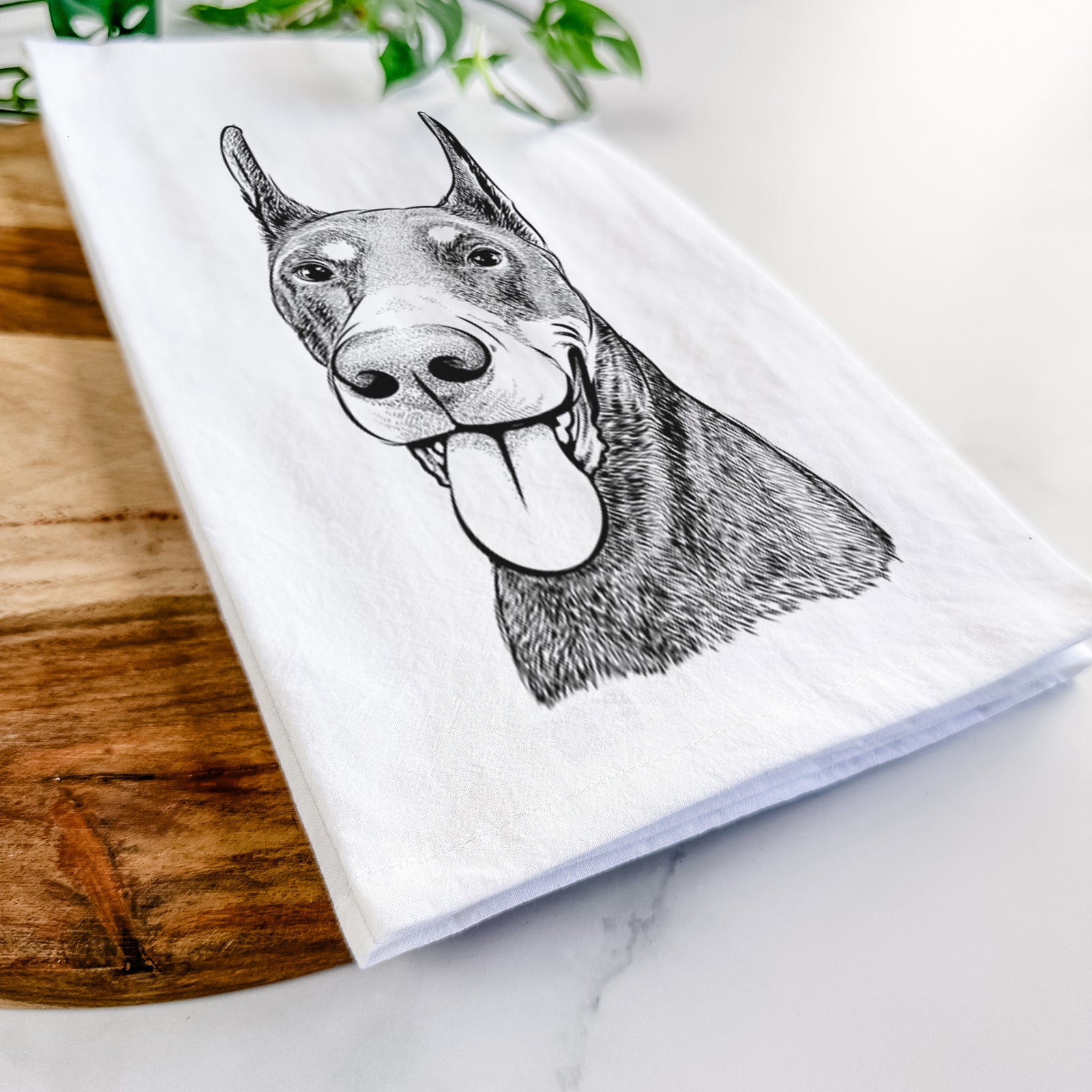 Hand-drawn sketch of Happy Sunny the Doberman Pinscher on a tea towel