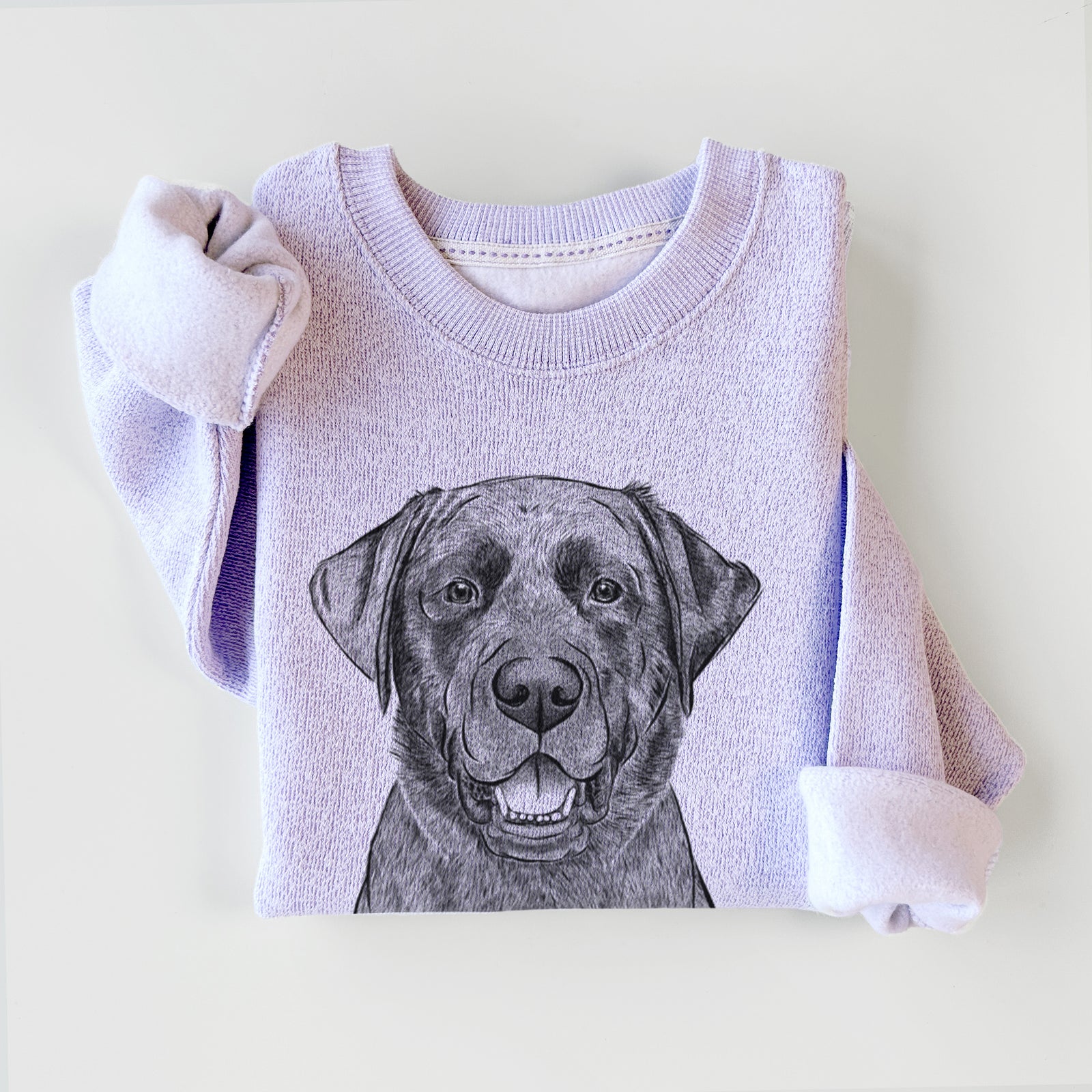 Hand-drawn sketch of Heath the Black Lab on an Ice Purple knit sweatshirt
