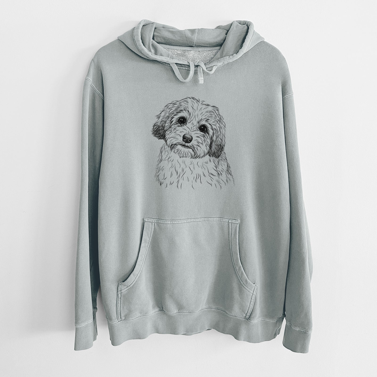 Hand-drawn sketch of Henry the Havanese on a Sage Unisex pigment dyed hoodie