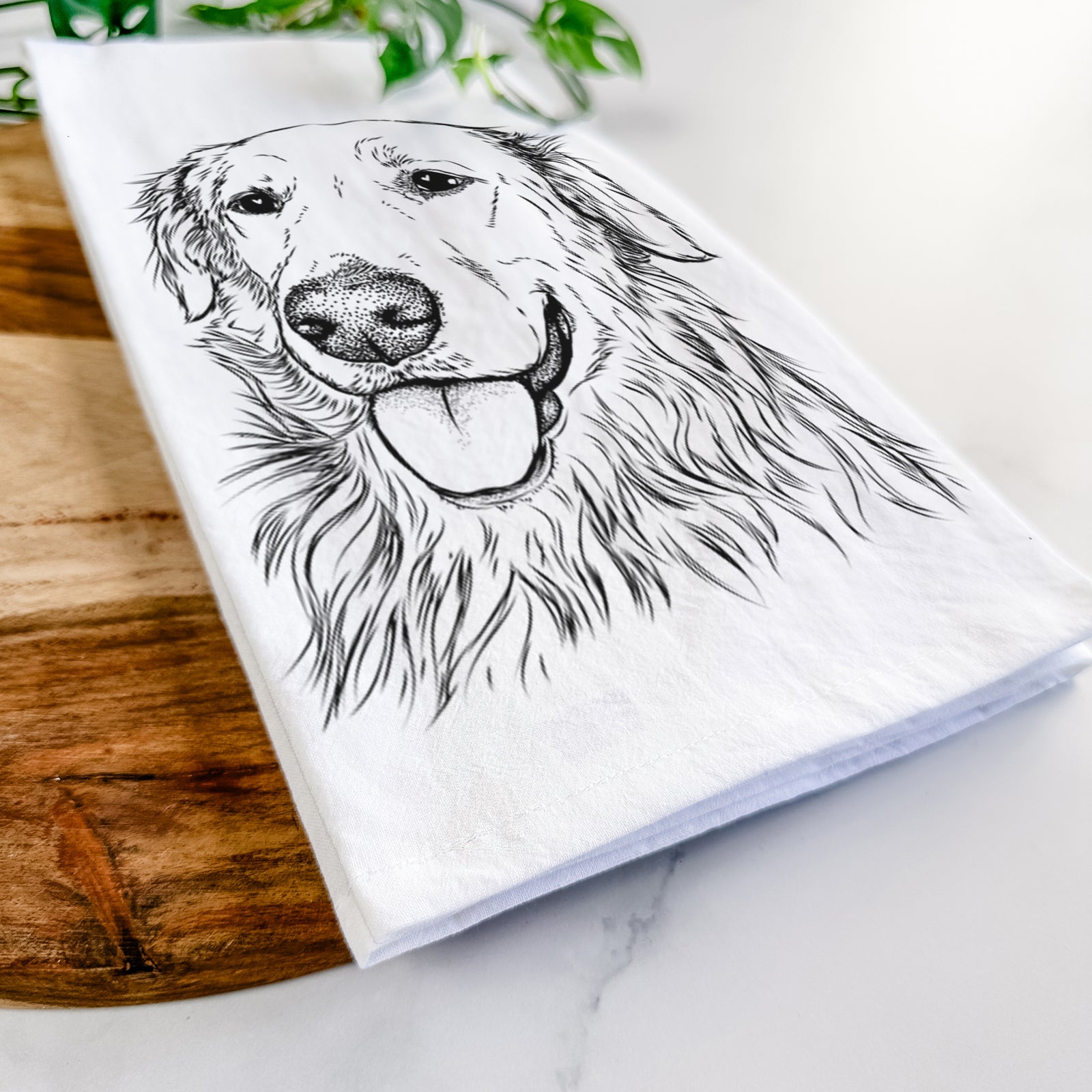 Hand-drawn sketch of Hopper the Golden Retriever on a tea towel
