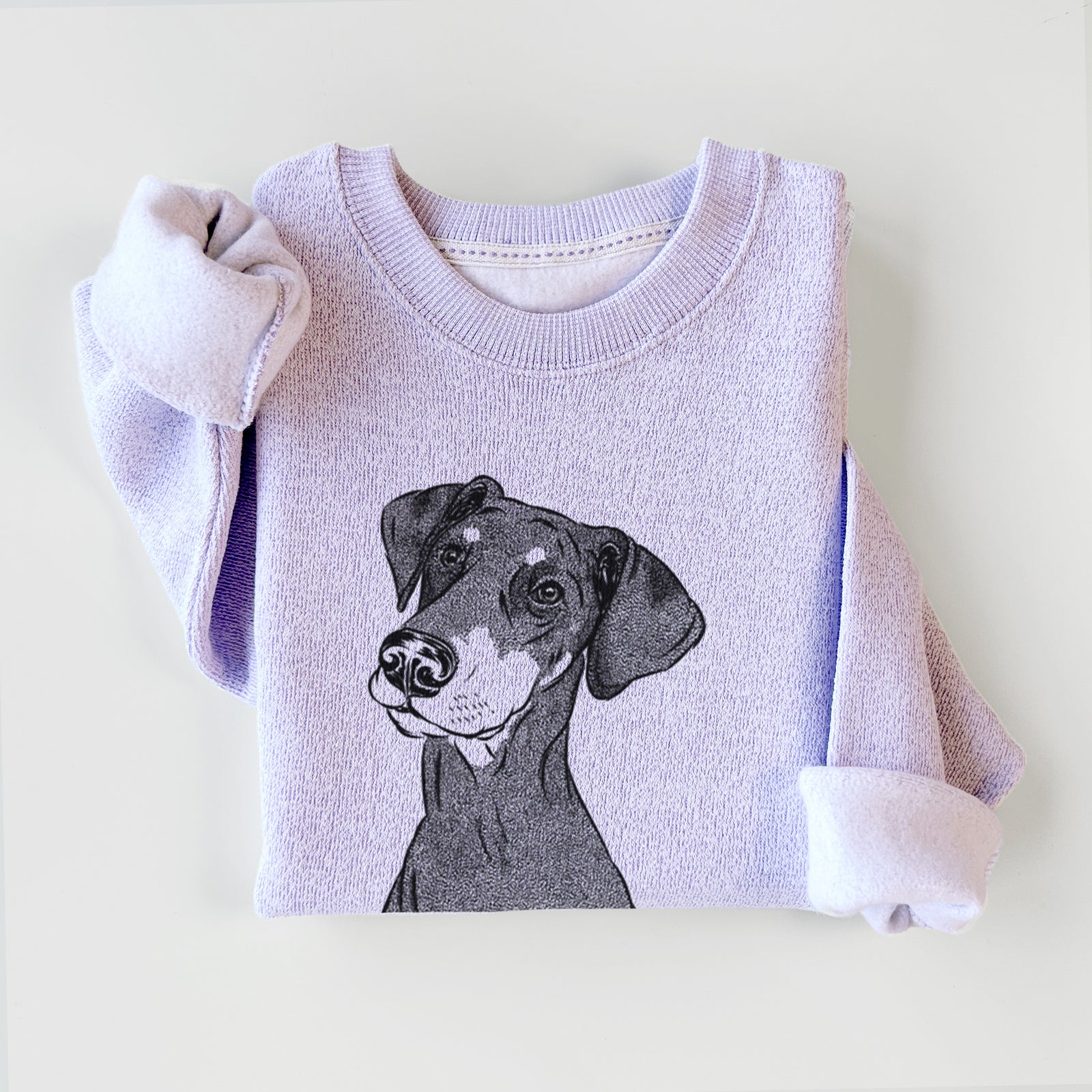 Hand-drawn sketch of Iroh the Doberman Pinscher on an Ice Purple knit sweatshirt