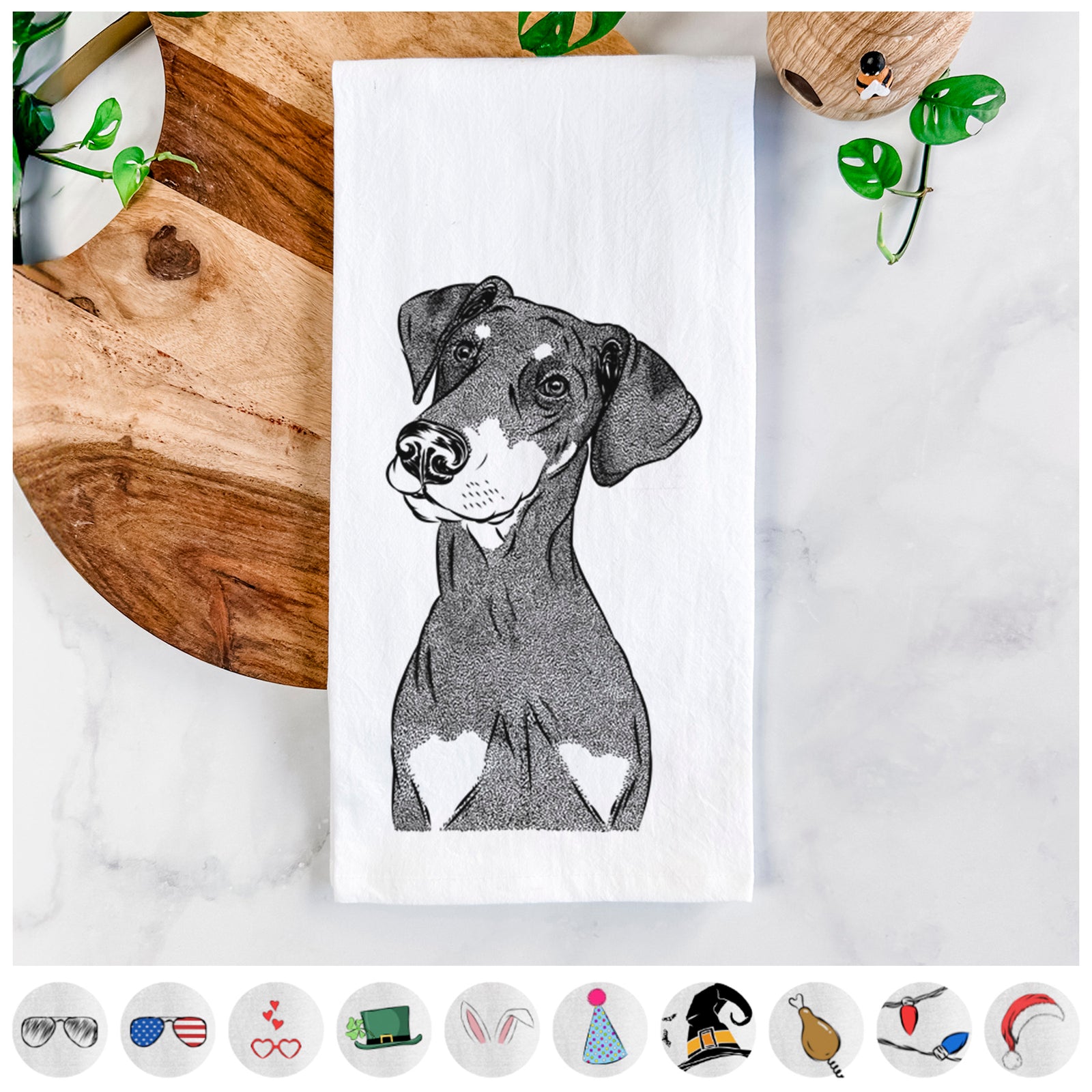 Hand-drawn sketch of Iroh the Doberman Pinscher on a tea towel, shown with icons of the other available costume styles