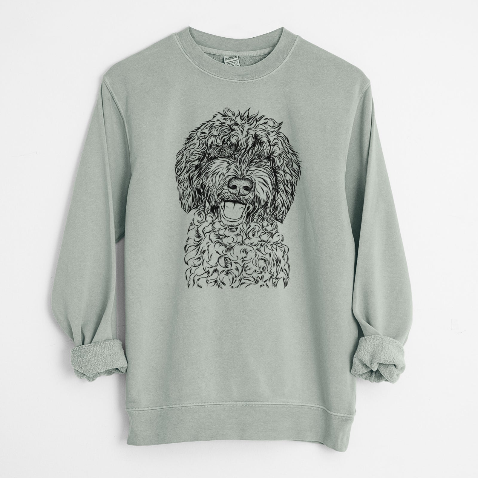 Hand-drawn sketch of Jack the Chocolate Labradoodle on a Sage Unisex pigment dyed crew sweatshirt