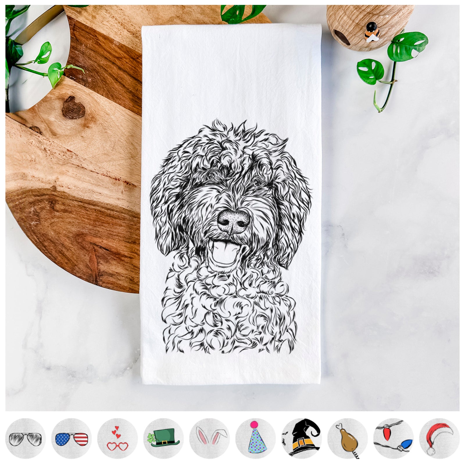 Hand-drawn sketch of Jack the Chocolate Labradoodle on a tea towel, shown with icons of the other available costume styles