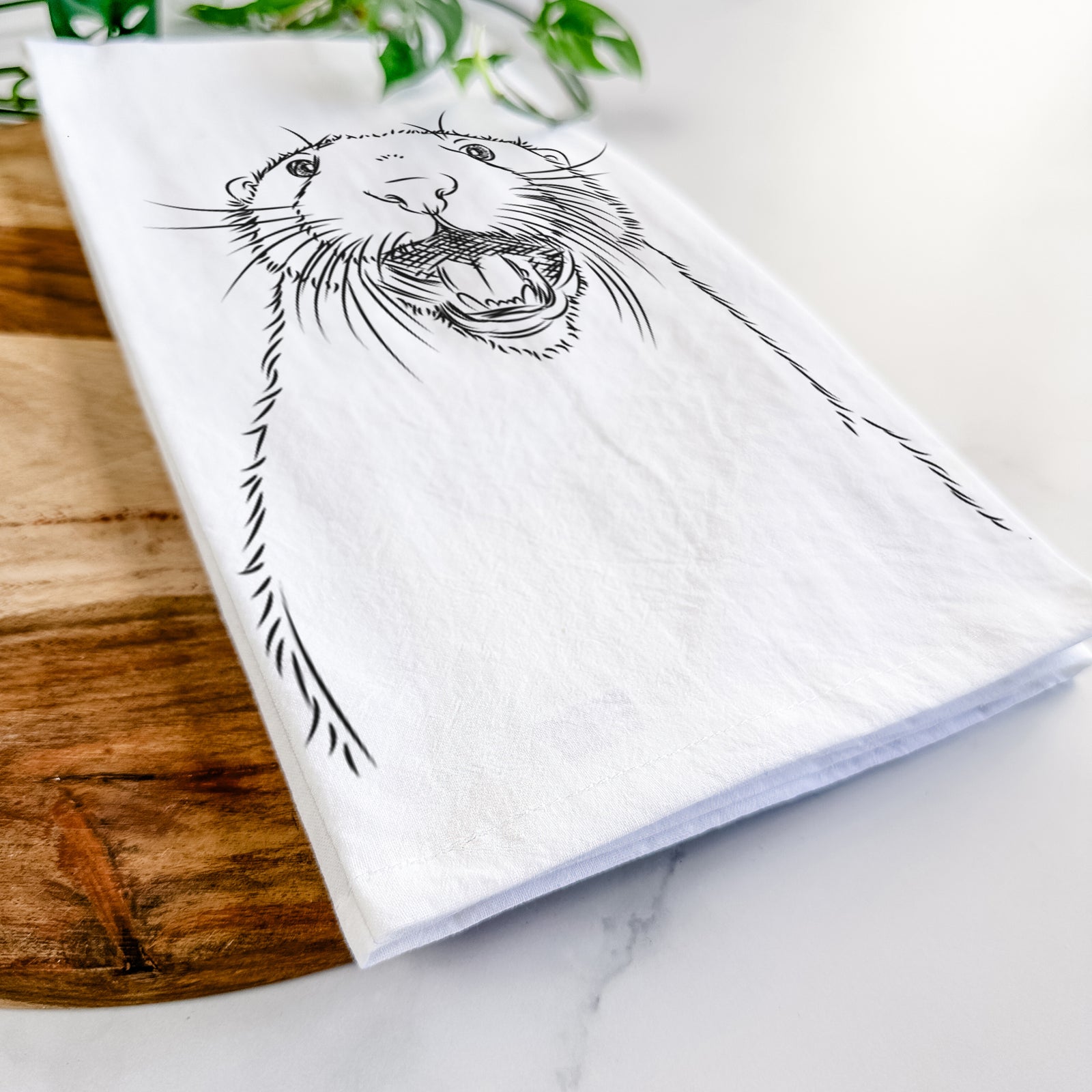 Hand-drawn sketch of Jasper the River Otter on a tea towel