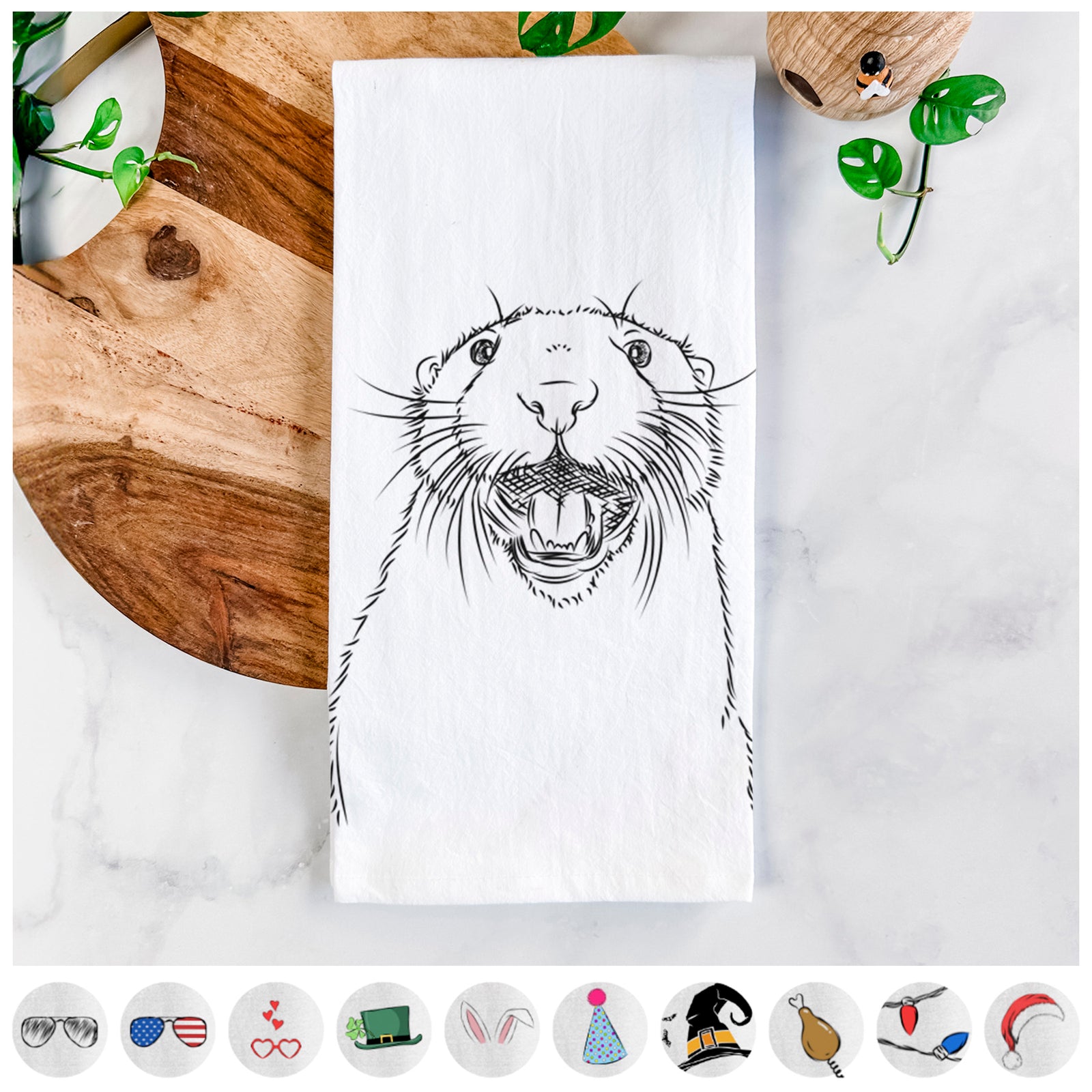 Hand-drawn sketch of Jasper the River Otter on a tea towel, shown with icons of the other available costume styles