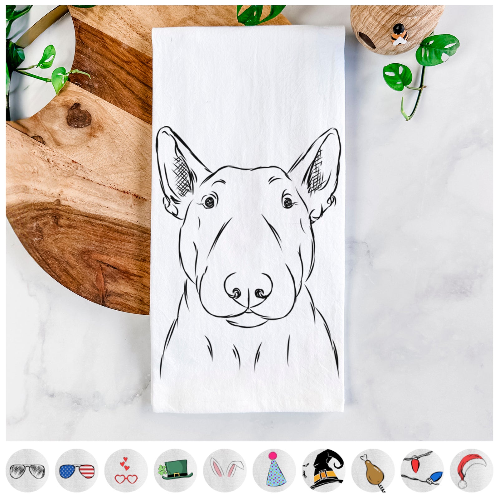 Hand-drawn sketch of Jett the Bull Terrier on a tea towel, shown with icons of the other available costume styles