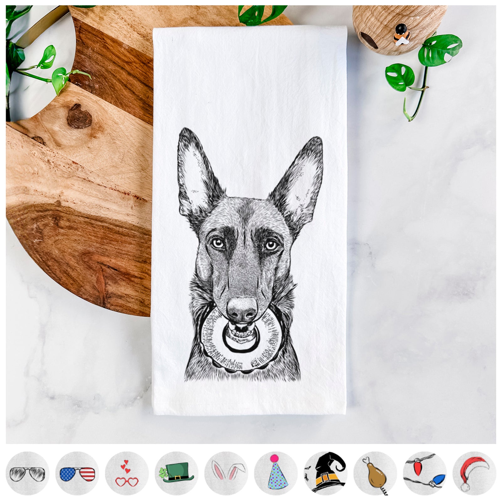 Hand-drawn sketch of Juno the Belgian Malinois on a tea towel, shown with icons of the other available costume styles