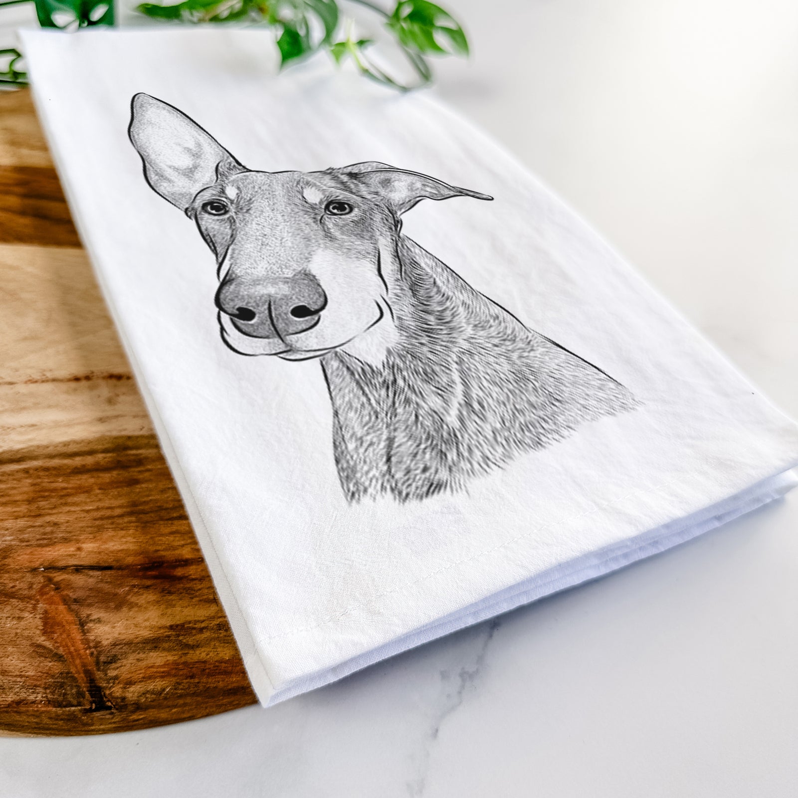 Hand-drawn sketch of Kain the Doberman Pinscher on a tea towel