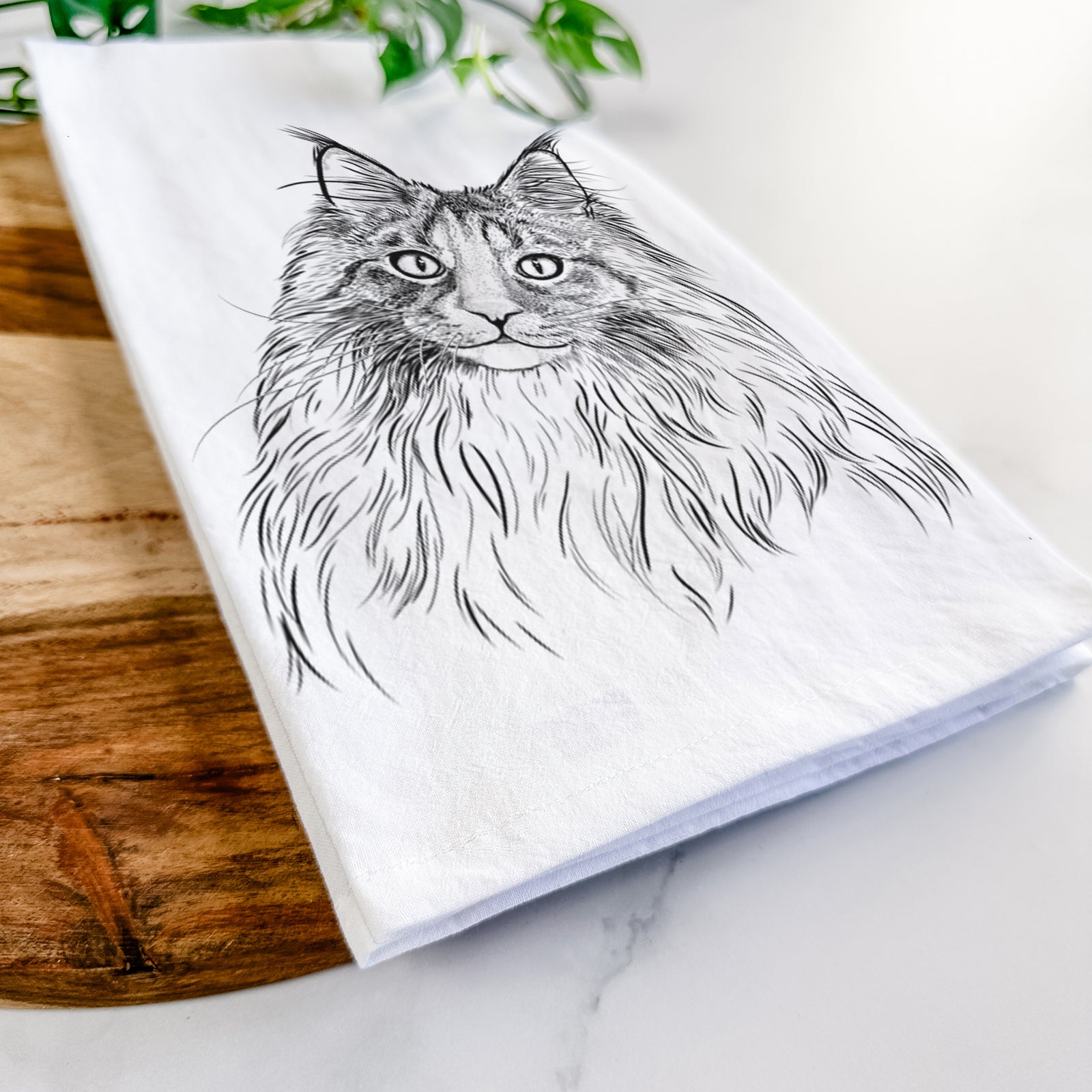 Hand-drawn sketch of Kiki the Maine Coon Cat on a tea towel