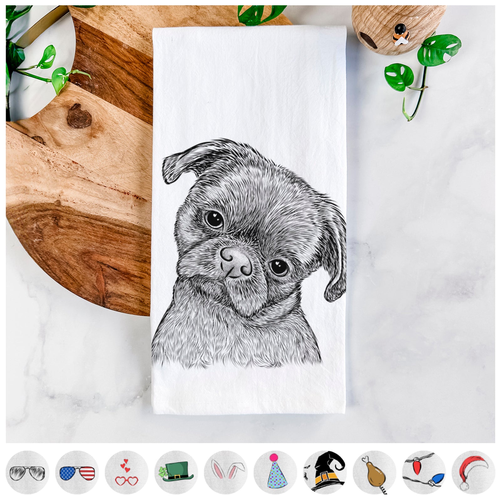 Hand-drawn sketch of Koko the Shih Tzu on a tea towel, shown with icons of the other available costume styles