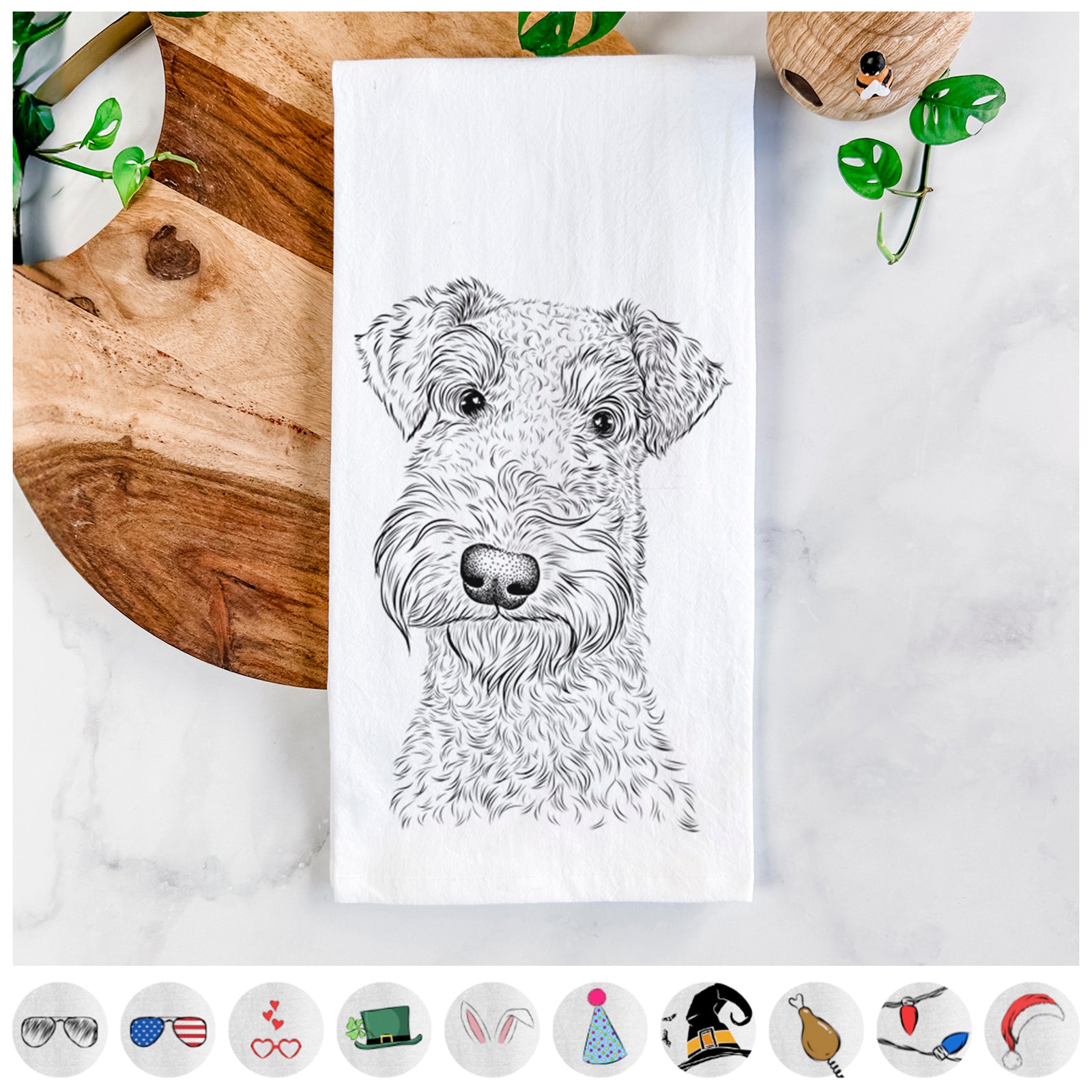 Hand-drawn sketch of Roc Haven Maggie May the Airedale Terrier on a tea towel, shown with icons of the other available costume styles