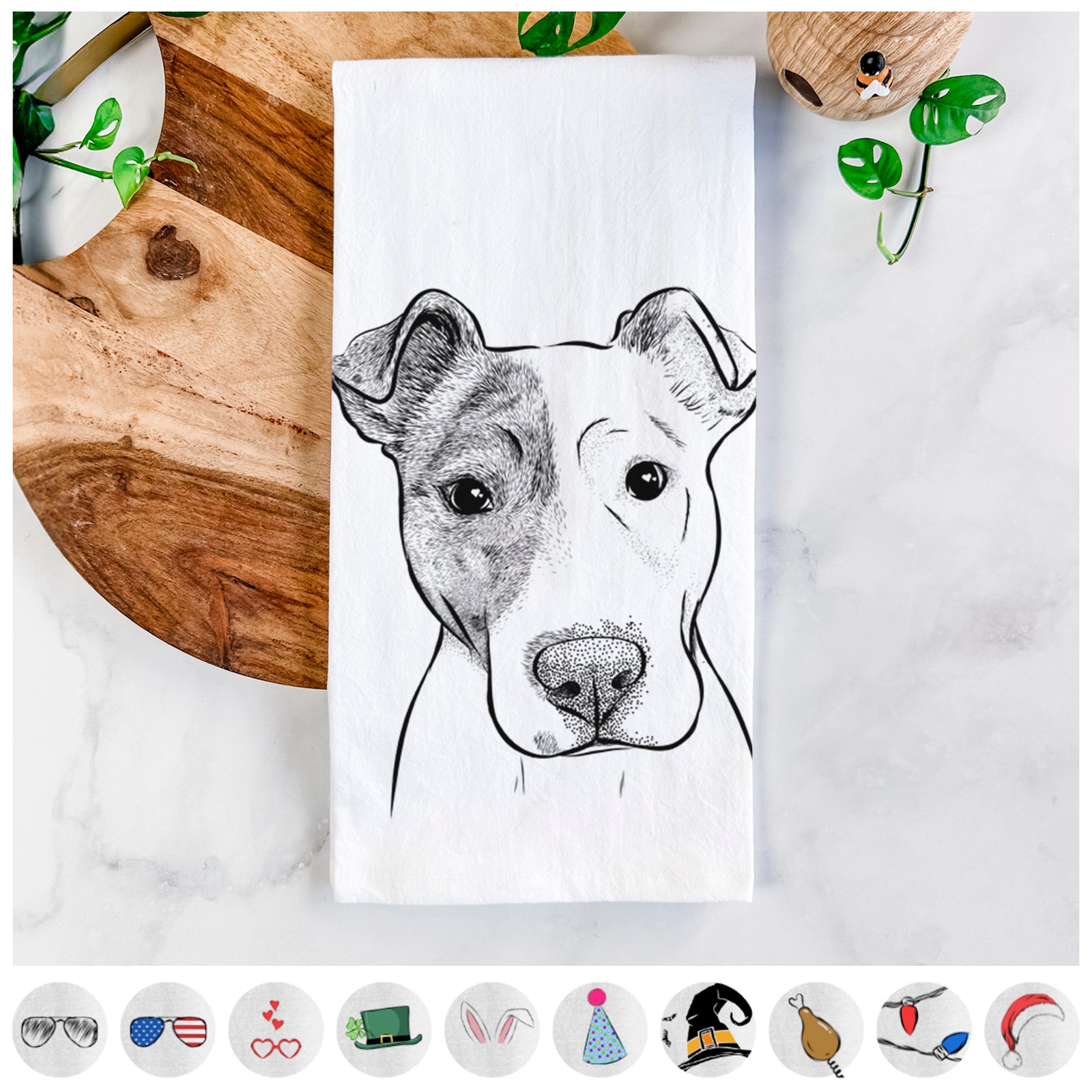 Hand-drawn sketch of Manchi the Pitbull Mix on a tea towel, shown with icons of the other available costume styles